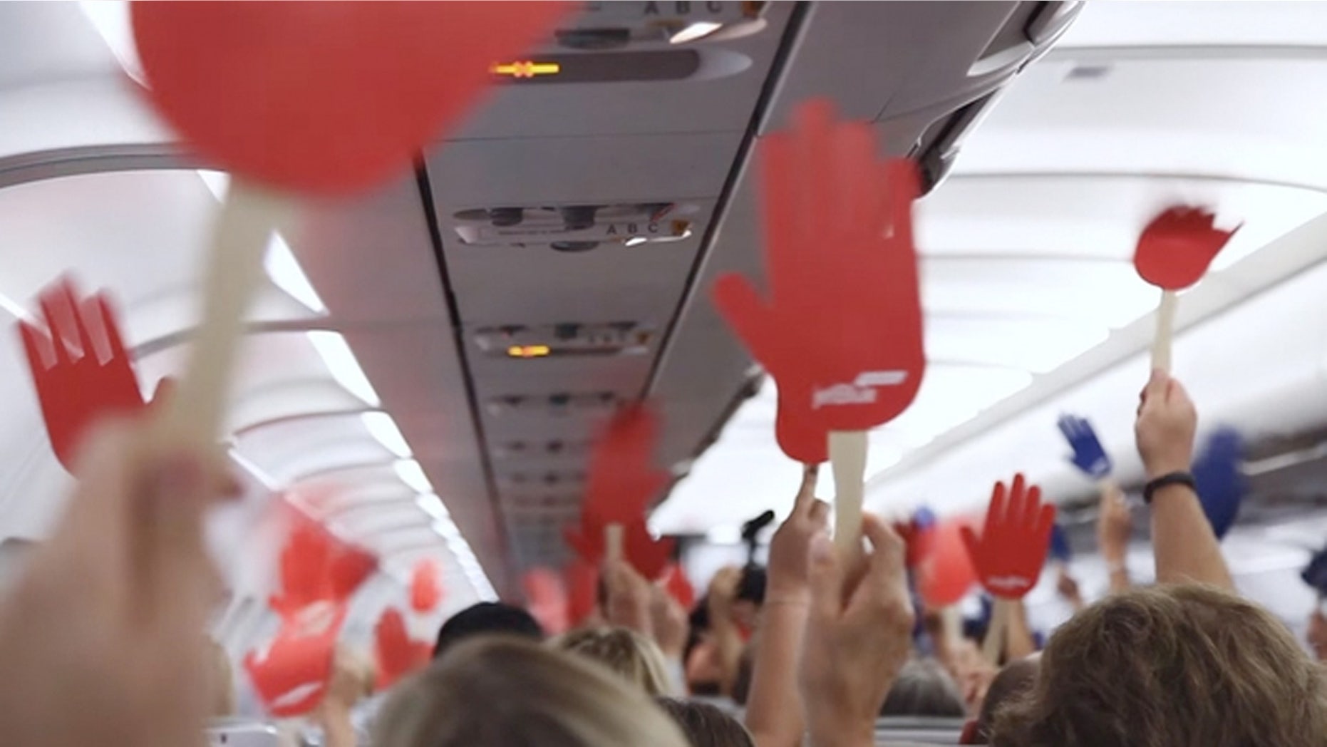 On a JetBlue flight from Boston to Phoenix, the airline filmed a commercial offering each of the 150 passengers a free roundtrip ticket to any destination in the world --if they could compromise.