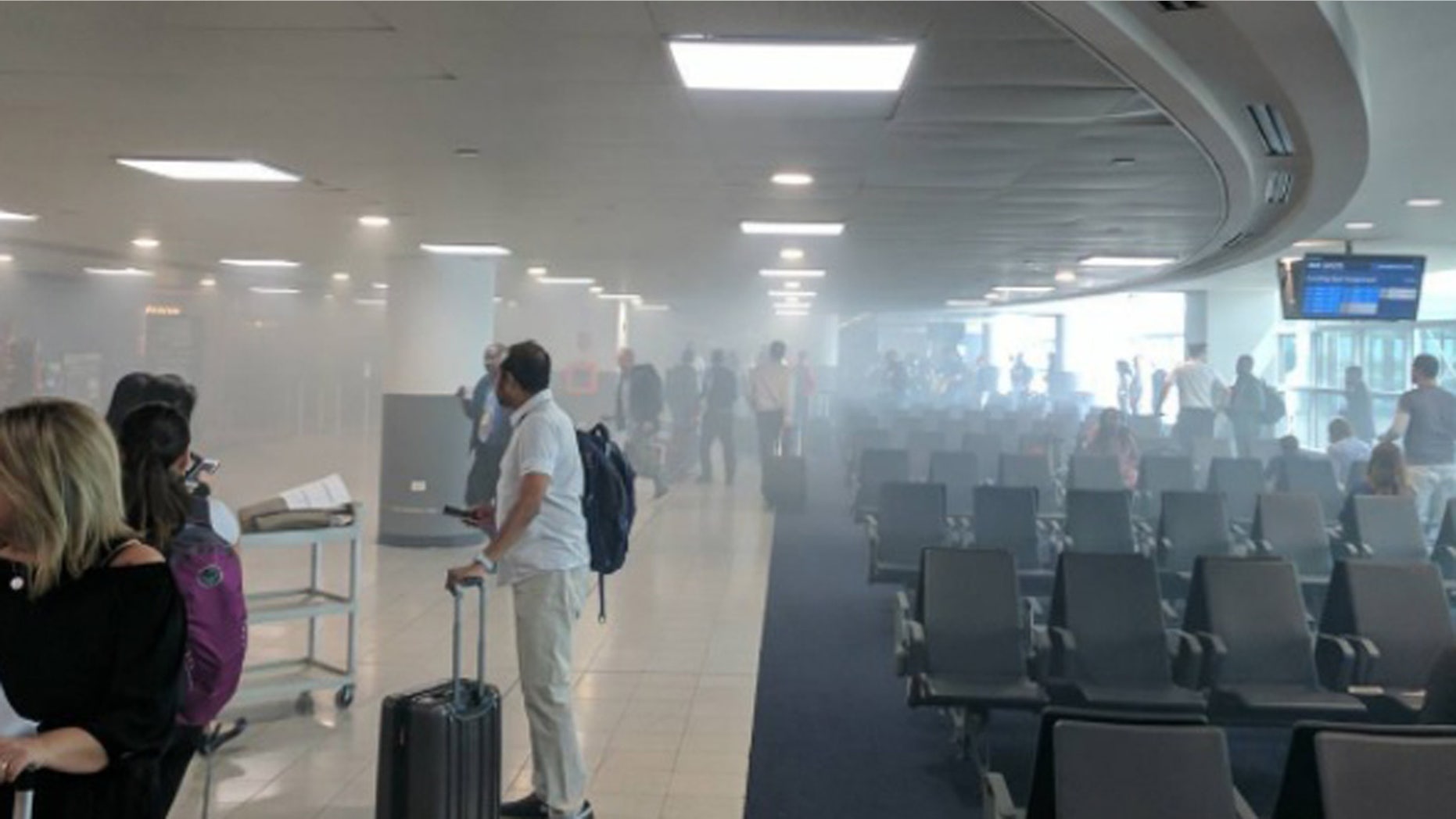 A restaurant fire at John F. Kennedy Airport in New York filled Terminal 4 with smoke.