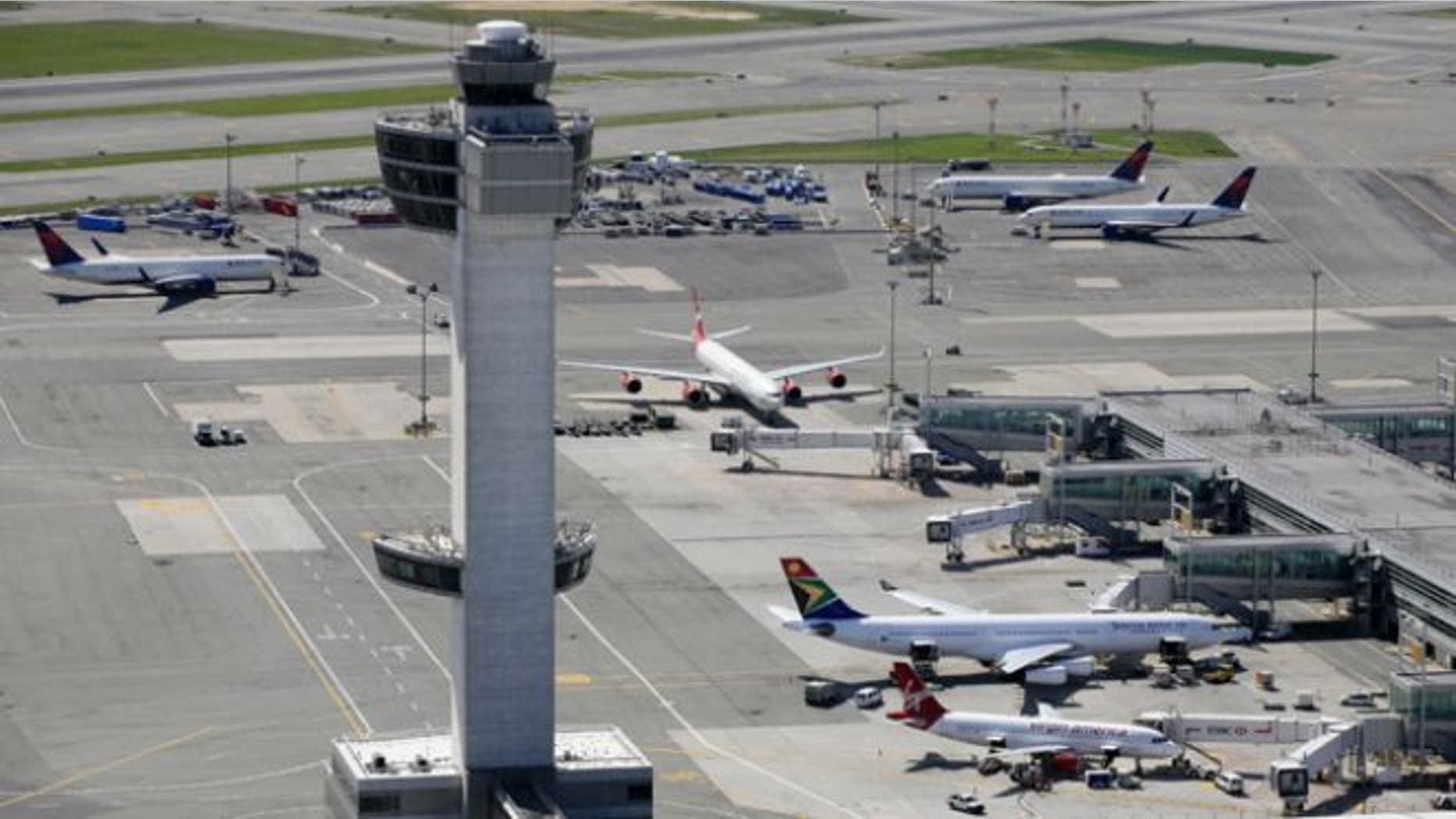 FILE: April 2010: The air traffic control tower and terminals at John F. Kennedy International Airport in New York.