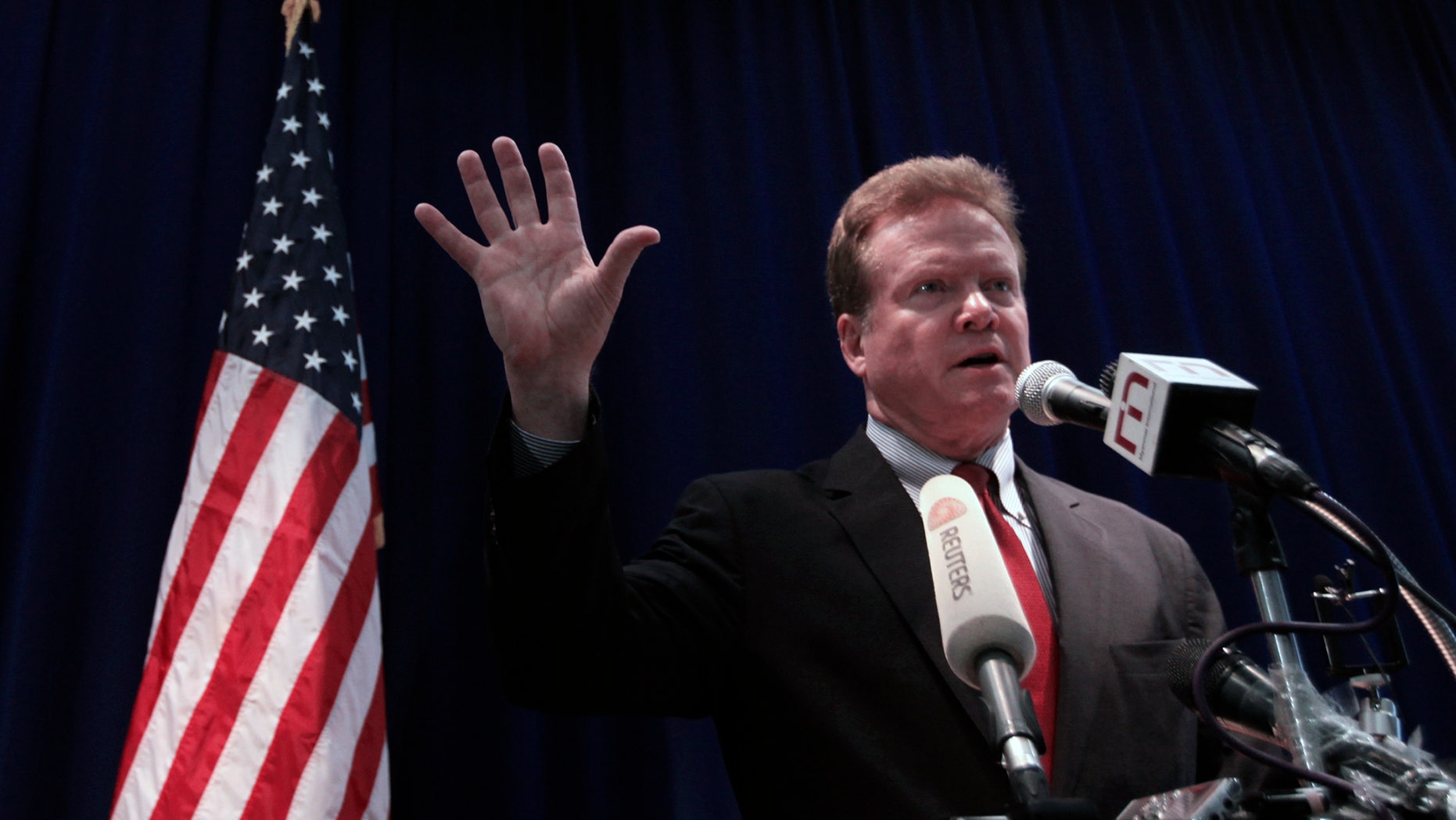Sen. Jim Webb talks to reporters during his news conference at the U.S. embassy in Yangon, April 11, 2012. (REUTERS/Soe Zeya Tun)
