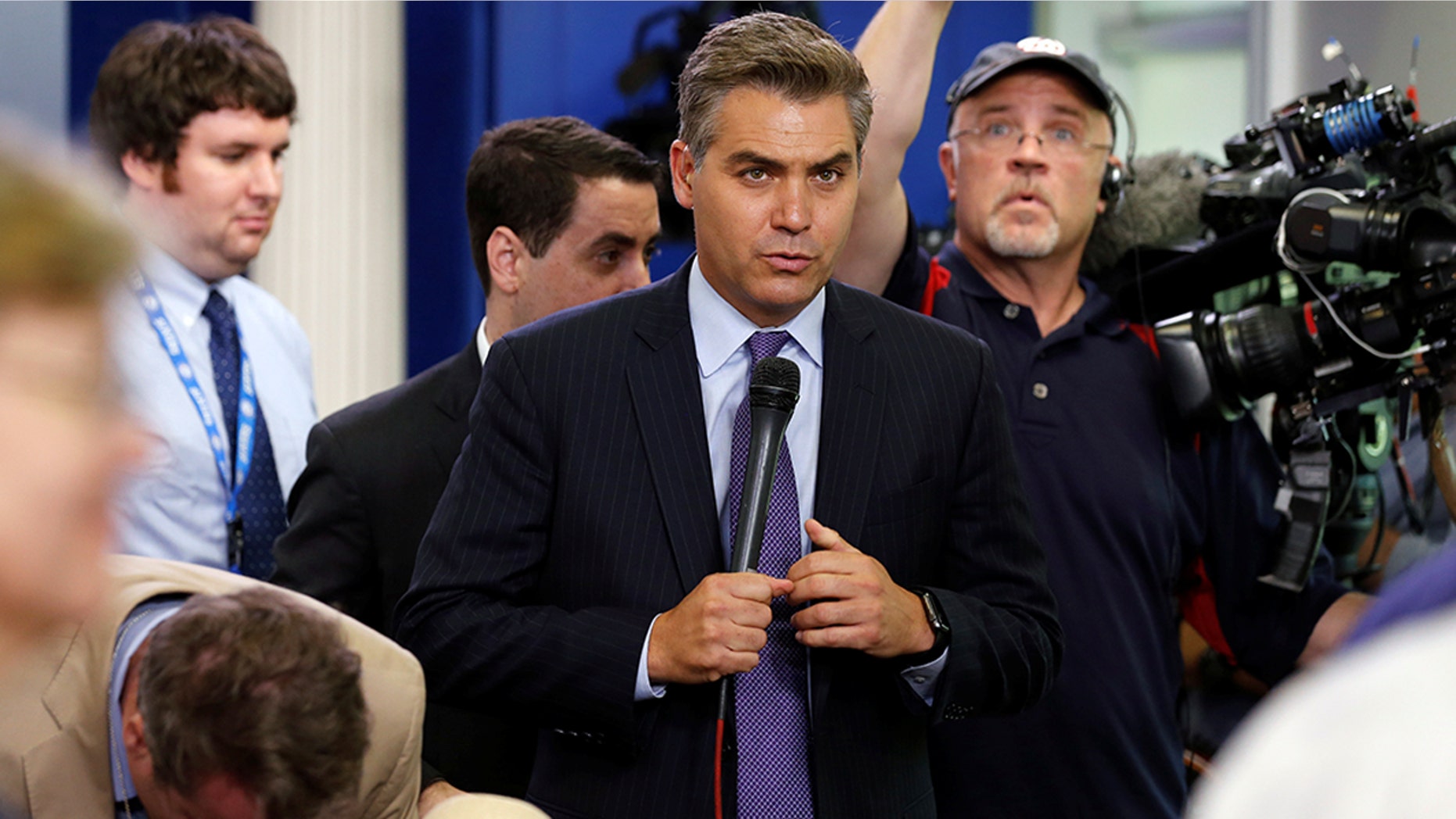 CNN White House correspondent Jim Acosta prepares to go on the air after the daily press briefing, during which he had a contentious exchanges with White House senior policy advisor Stephen Miller, at the White House in Washington, U.S. August 2, 2017. REUTERS/Jonathan Ernst - RC1693D7B420