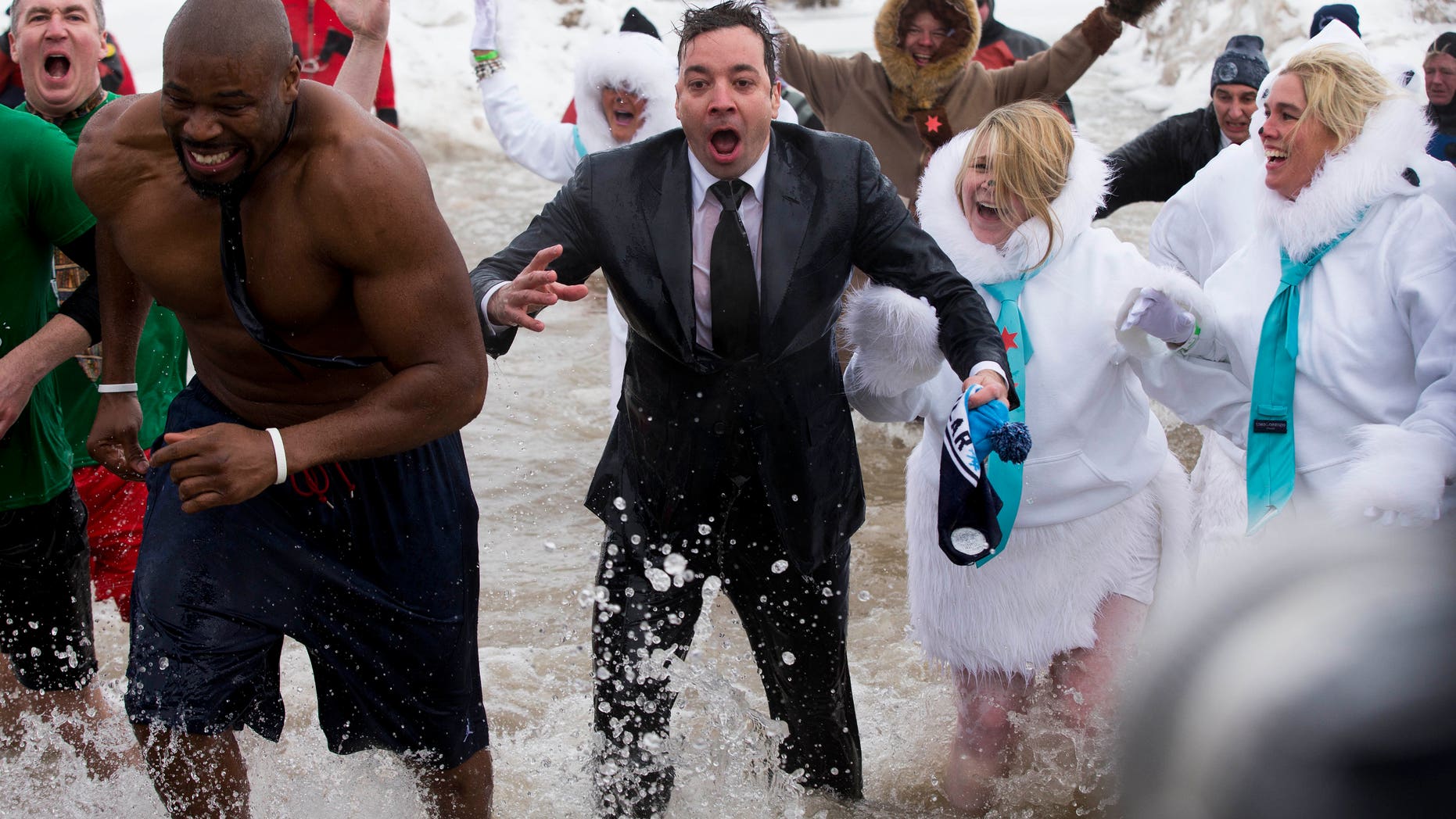 March 2, 2014. "The Tonight Show" host Jimmy Fallon, center, exits the water during the Chicago Polar Plunge. Fallon joined Chicago Mayor Rahm Emanuel in the event.