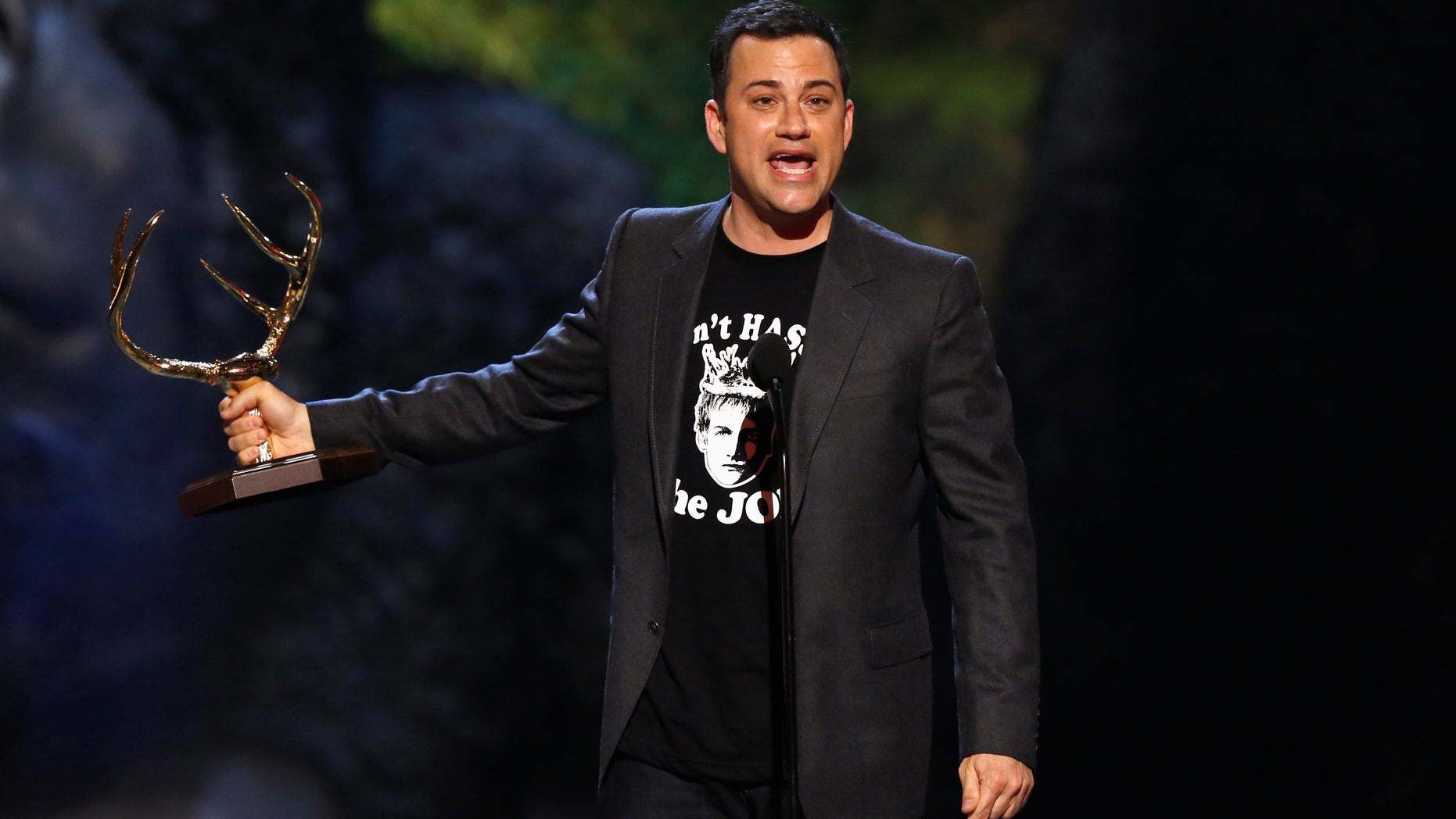 June 8, 2013. Jimmy Kimmel accepts an award at the seventh annual Spike TV "Guys Choice" awards in Culver City, California.