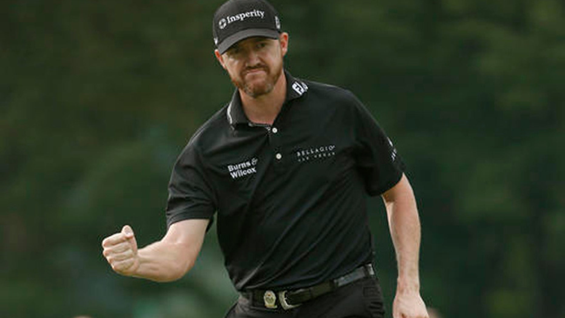 Jimmy Walker reacts to his birdie putt on the 11th hole during the final round of the PGA Championship golf tournament at Baltusrol Golf Club in Springfield, N.J., Sunday, July 31, 2016.