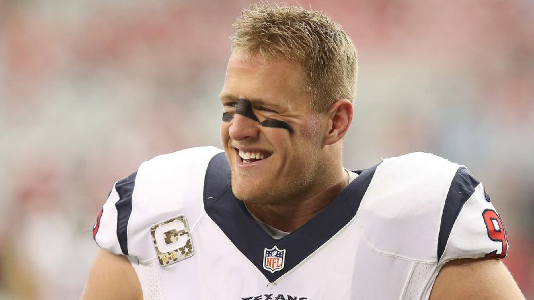 GLENDALE, AZ - NOVEMBER 10: Defensive end J.J. Watt #99 of the Houston Texans laughs during warmups for the game with the Arizona Cardinals at University of Phoenix Stadium on November 10, 2013 in Glendale, Arizona. (Photo by Stephen Dunn/Getty Images)