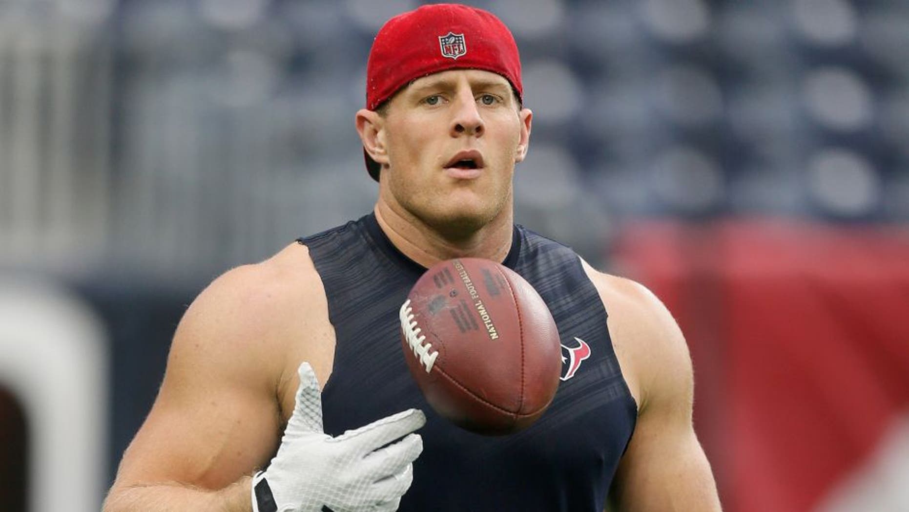 HOUSTON, TX - AUGUST 15: J.J. Watt #99 of the Houston Texans warms up before the Houston Texans play the San Francisco 49ers in a preseason football game at Reliant Arena at Reliant Park on August 15, 2015 in Houston, Texas. Houston won 23-10. (Photo by Bob Levey/Getty Images)