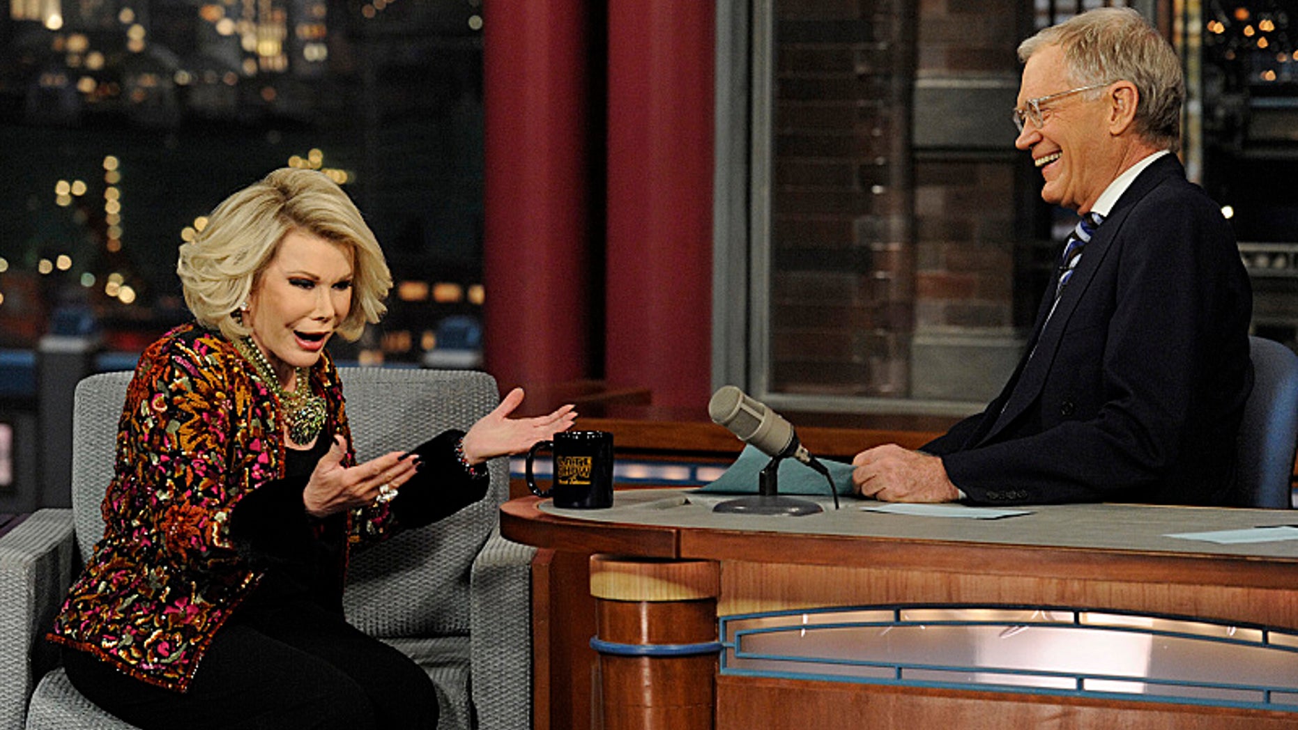 Comedian Joan Rivers shares a laugh with Dave when she visits the Late Show with David Letterman Tuesday Feb. 26, 2013 on the CBS Television Network.