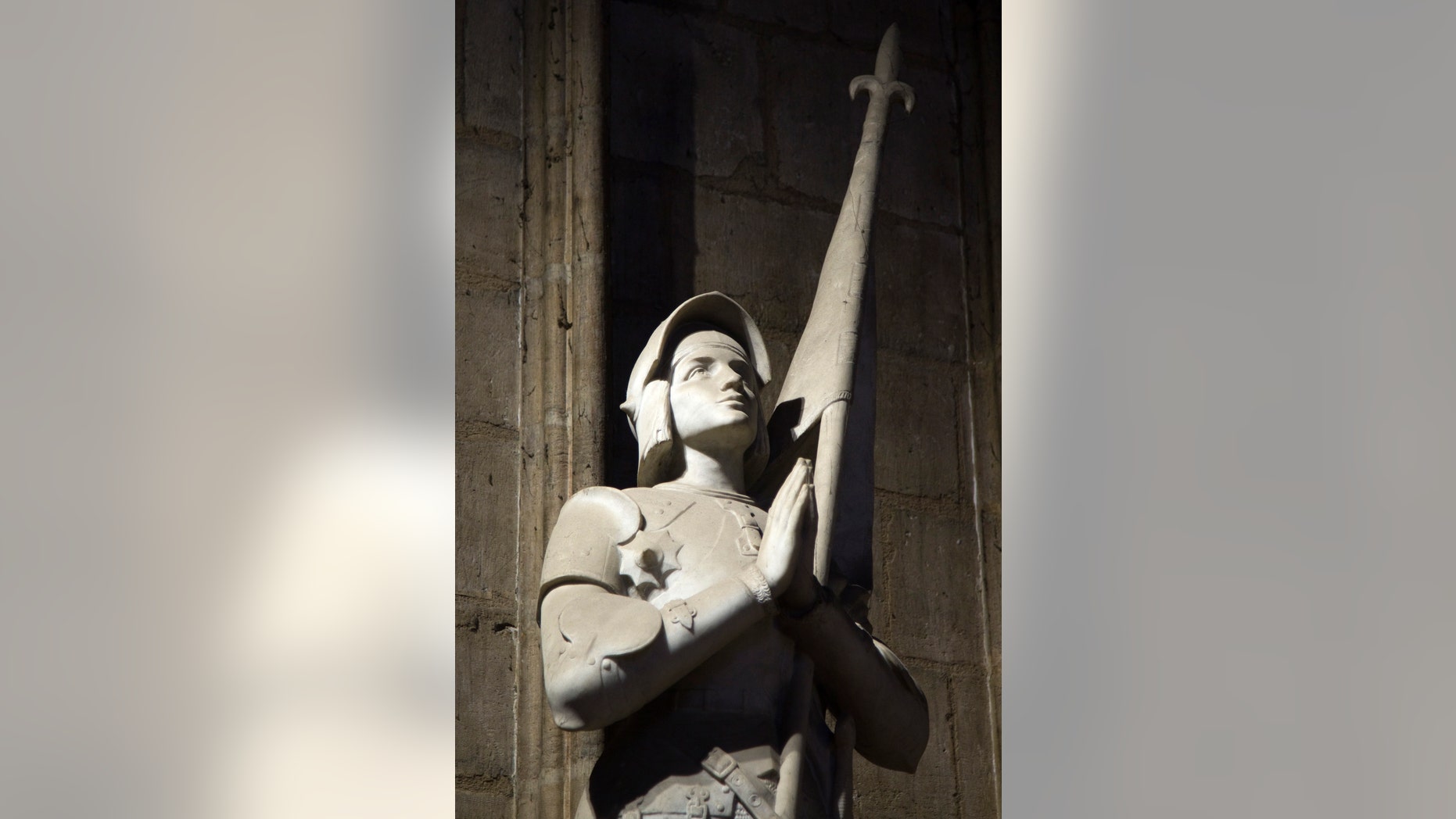 File photo - The statue of Jeanne d'Arc (St Joan of Arc,1412-1431) by French sculptor Charles Desvergnes is pictured inside Notre-Dame de Paris Cathedral in Paris Oct.18, 2012. (REUTERS/Charles Platiau)