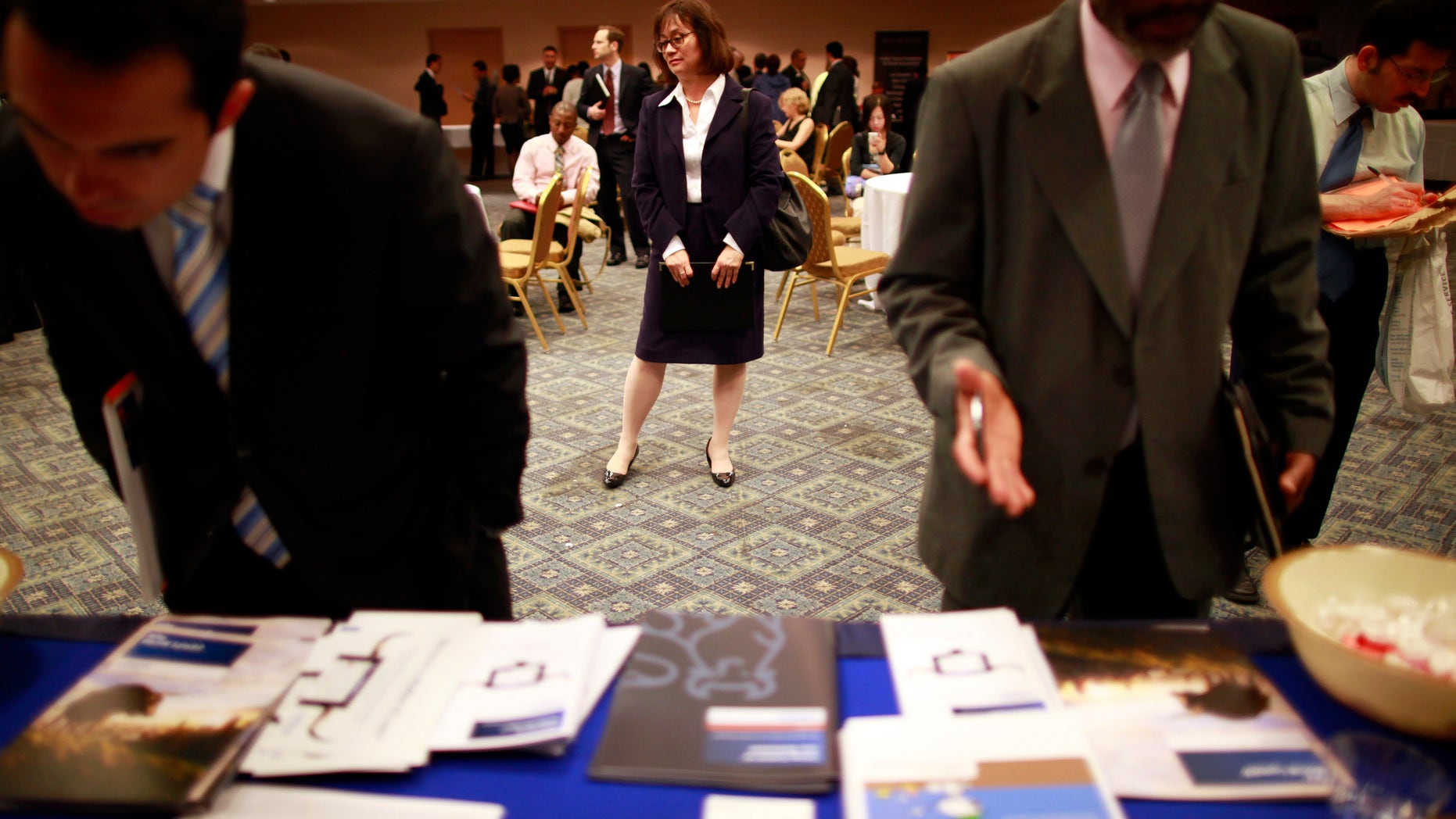 FILE: June 11, 2012: People participate in a job fair in New York. N.Y.
