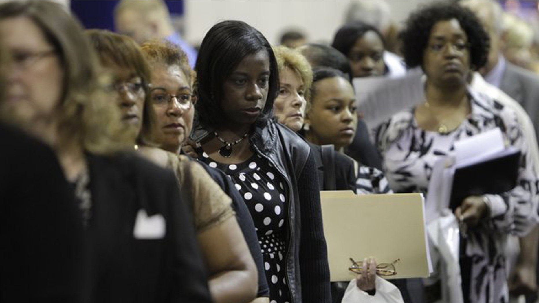 Aug. 25, 2010: Job seekers stand in line at a job fair outside Detroit.