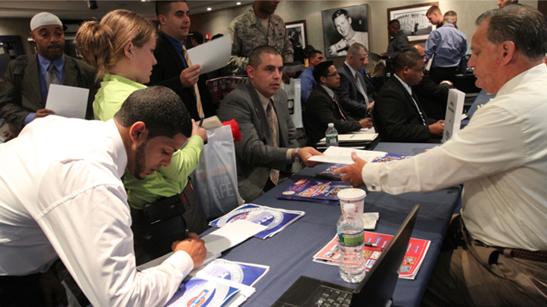 Sept. 28, 2012: Job-seekers hand in resumes during a job fair at Yankee Stadium in the Bronx.