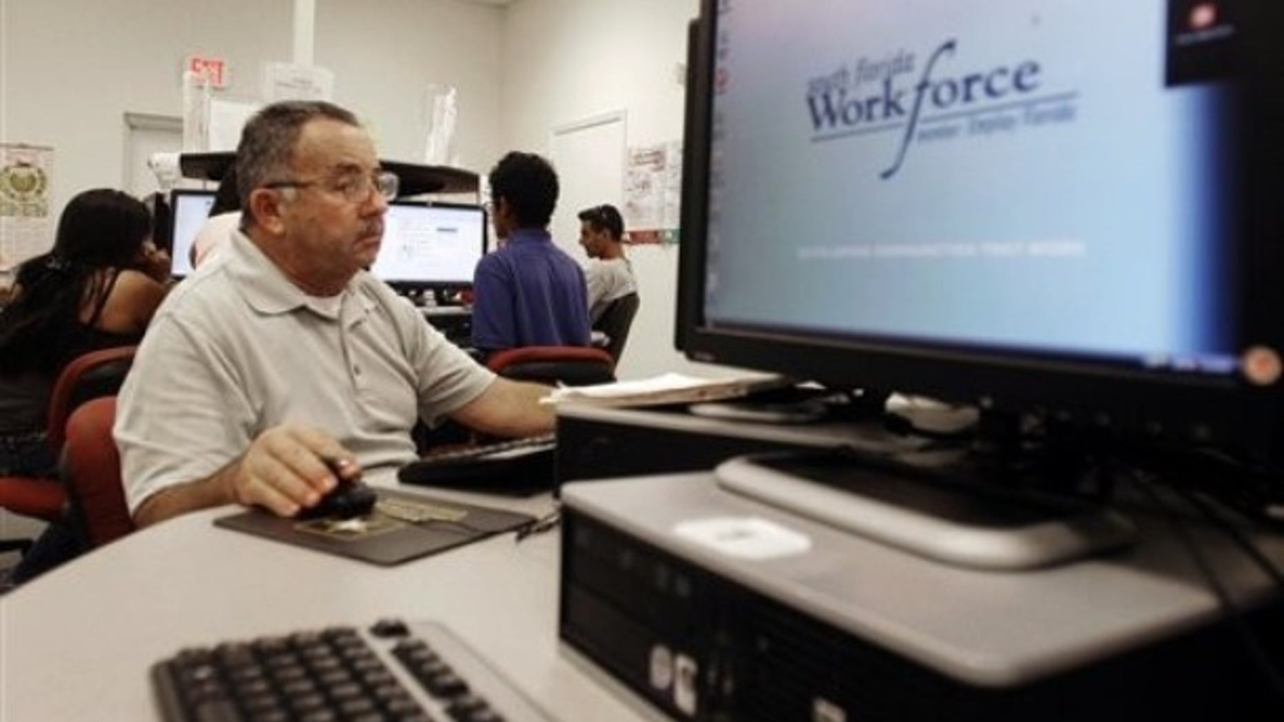 In this Sept. 2, 2010 photo, job seeker Jose Jaramillo , of Hialeah, works the computer as he looks for employment at the South Florida Workforce office in Hialeah Gardens, Fla. (AP)