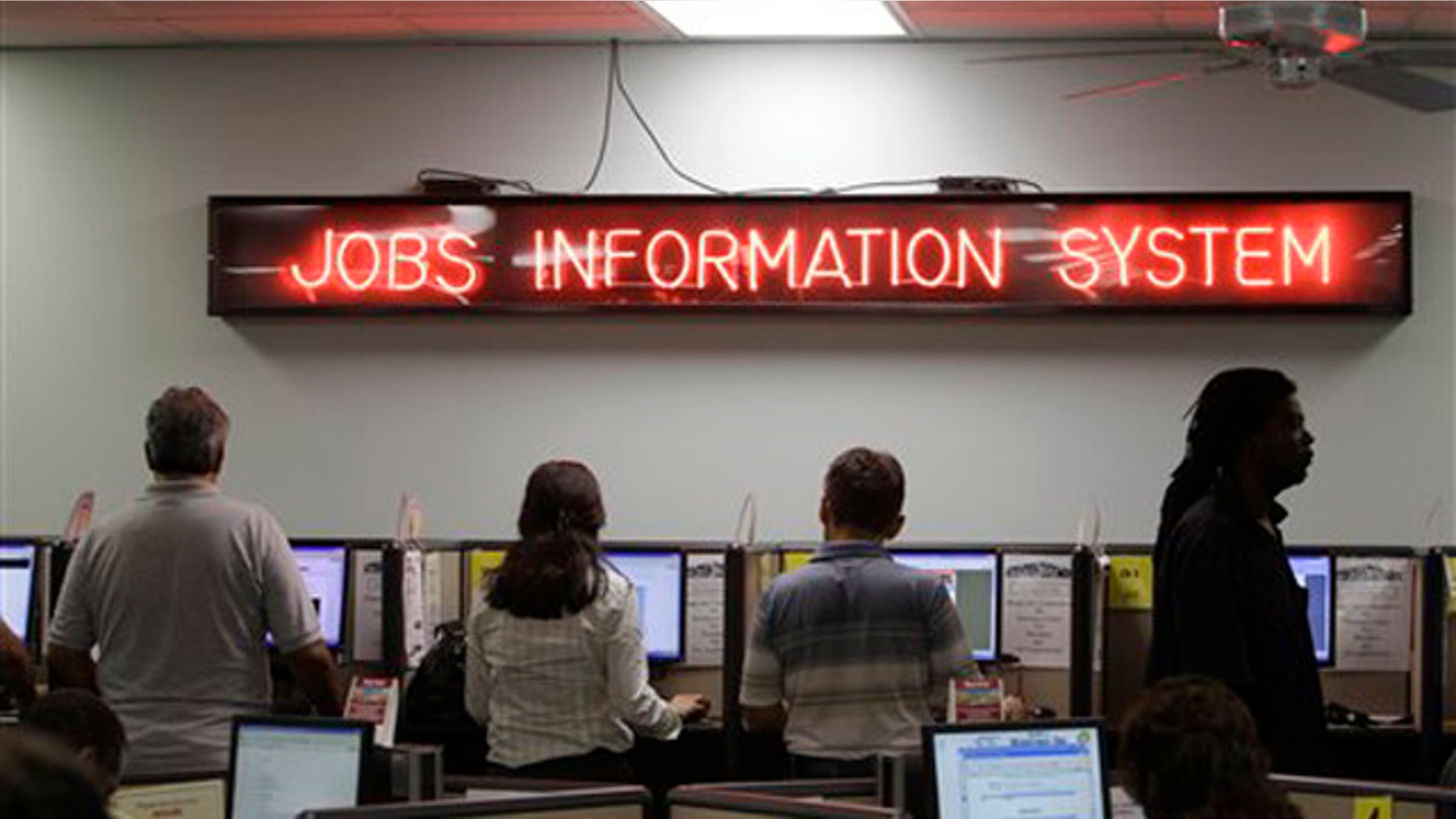 In this Sept. 1 photo, job seekers look for work on a bank of computers set up at Workforce One in Hollywood, Fla. (AP Photo)