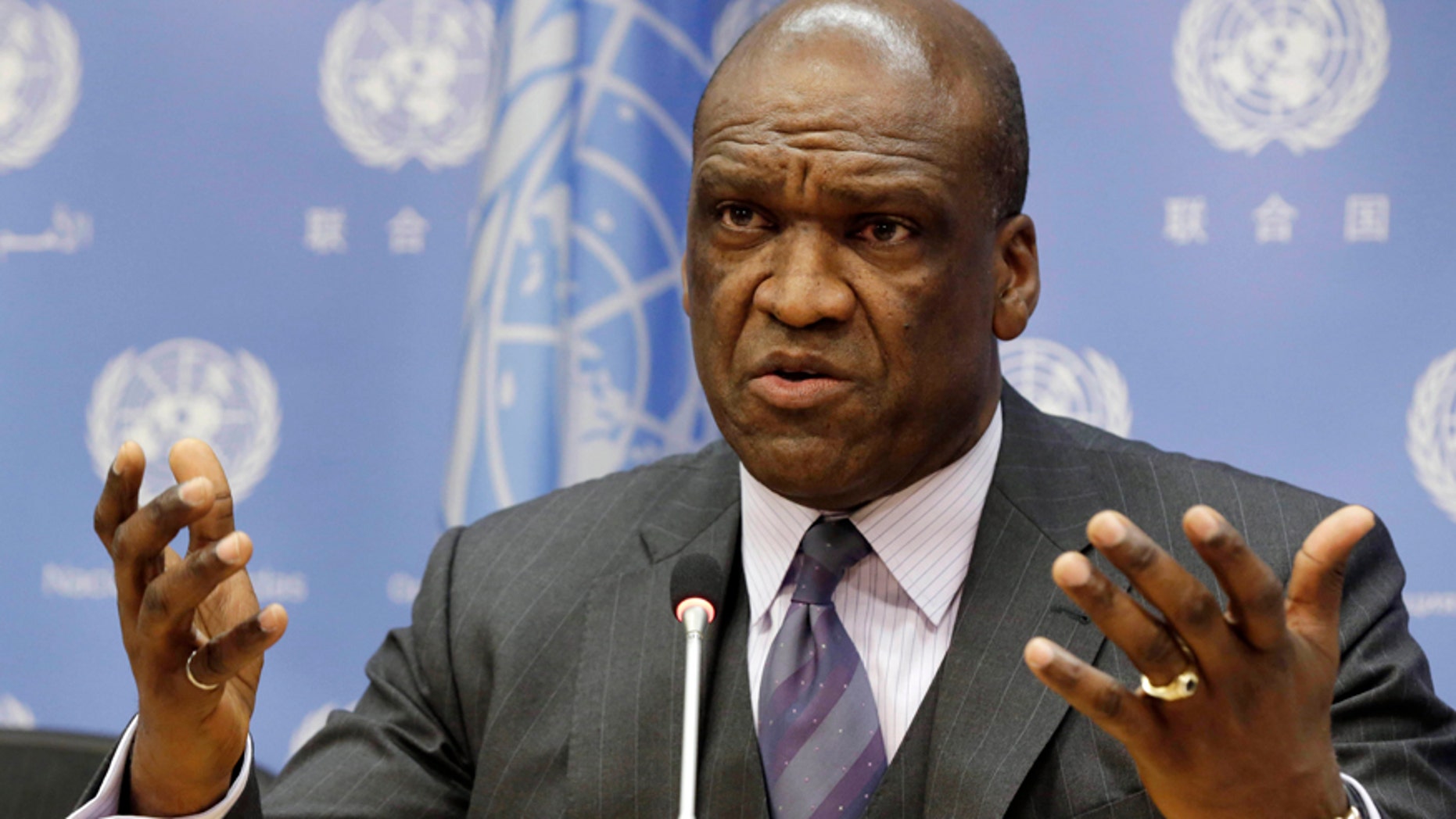 Sept. 17, 2013: Ambassador John Ashe, of Antigua and Barbuda, the former president of the General Assembly's 68th session, speaks during a news conference at United Nations headquarters.