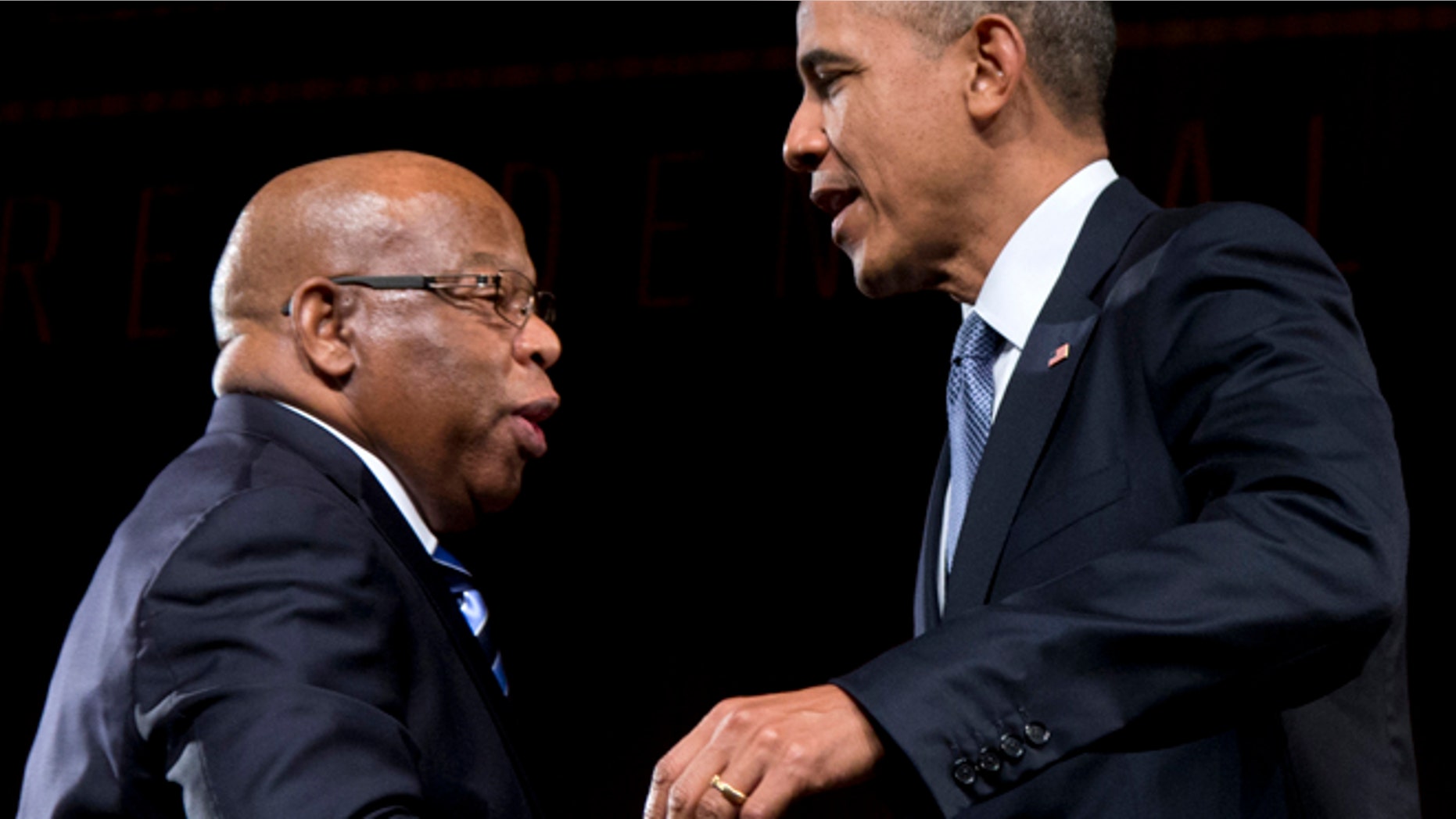 April 10, 2014: This photo shows President Barack Obama greeted by Rep. John Lewis, D-Ga., as he arrives to speak at the LBJ Presidential Library in Austin, Texas.