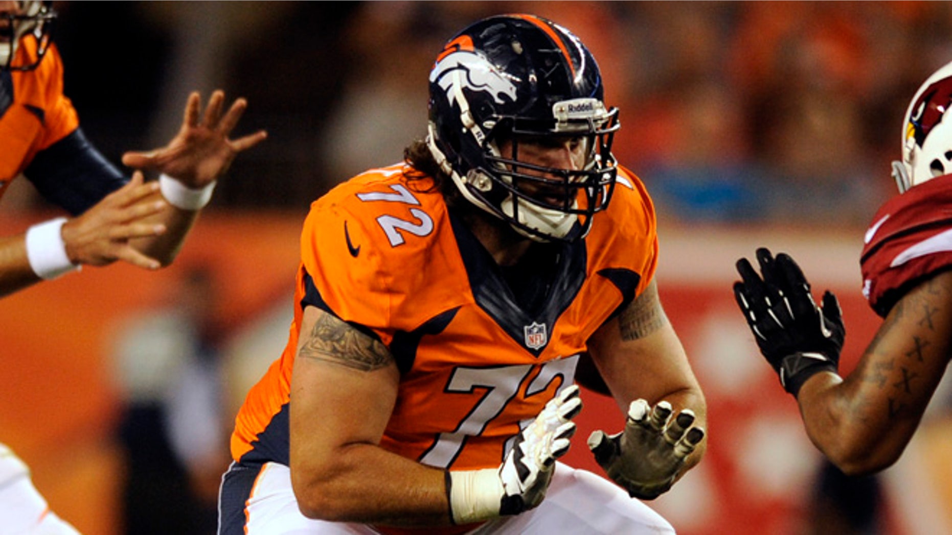 Aug. 29, 2013: Denver Broncos guard John Moffitt plays against the Arizona Cardinals during a pre-season NFL football game in Denver. Moffitt says he quit the NFL this week not because he was unhappy with a lack of playing time in Denver but because he'd lost his love for the game and was tired of risking his health.