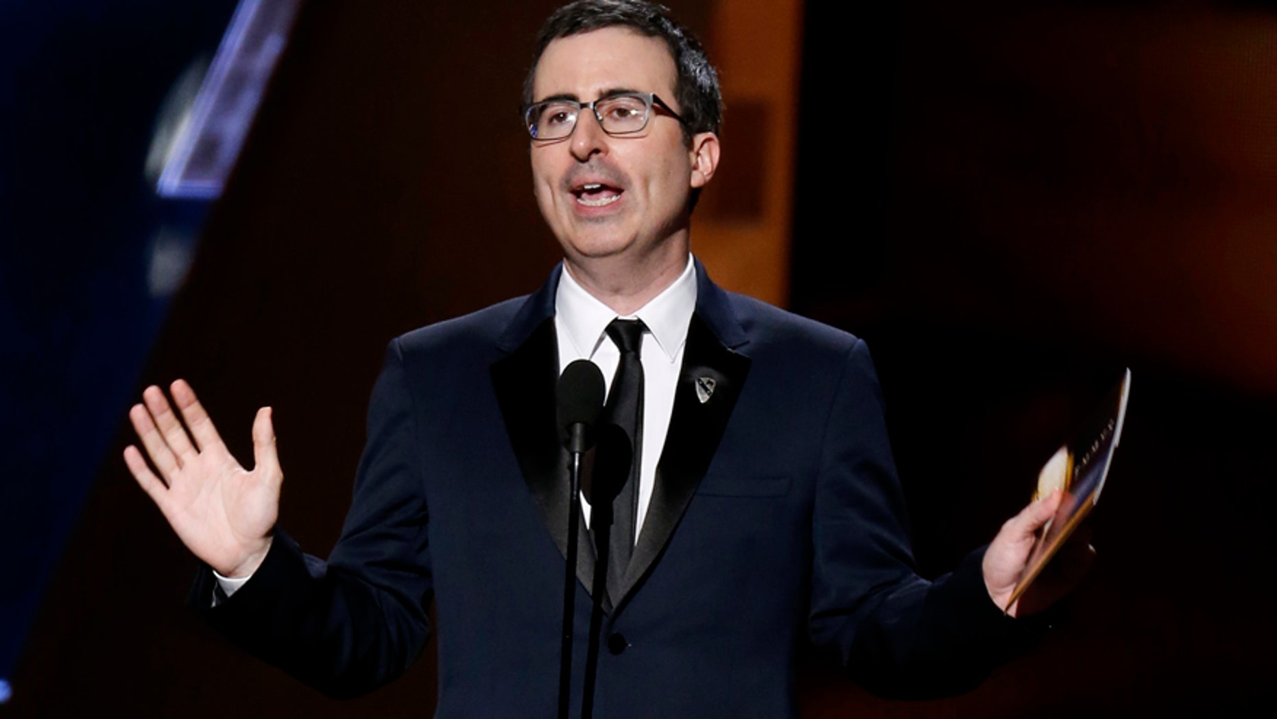 John Oliver tackled the Dustin Hoffman assault rumors during a live Q&A, but did not receive answers. Here Oliver presents an award at the 67th Annual Emmy Awards in Los Angeles, September 2015