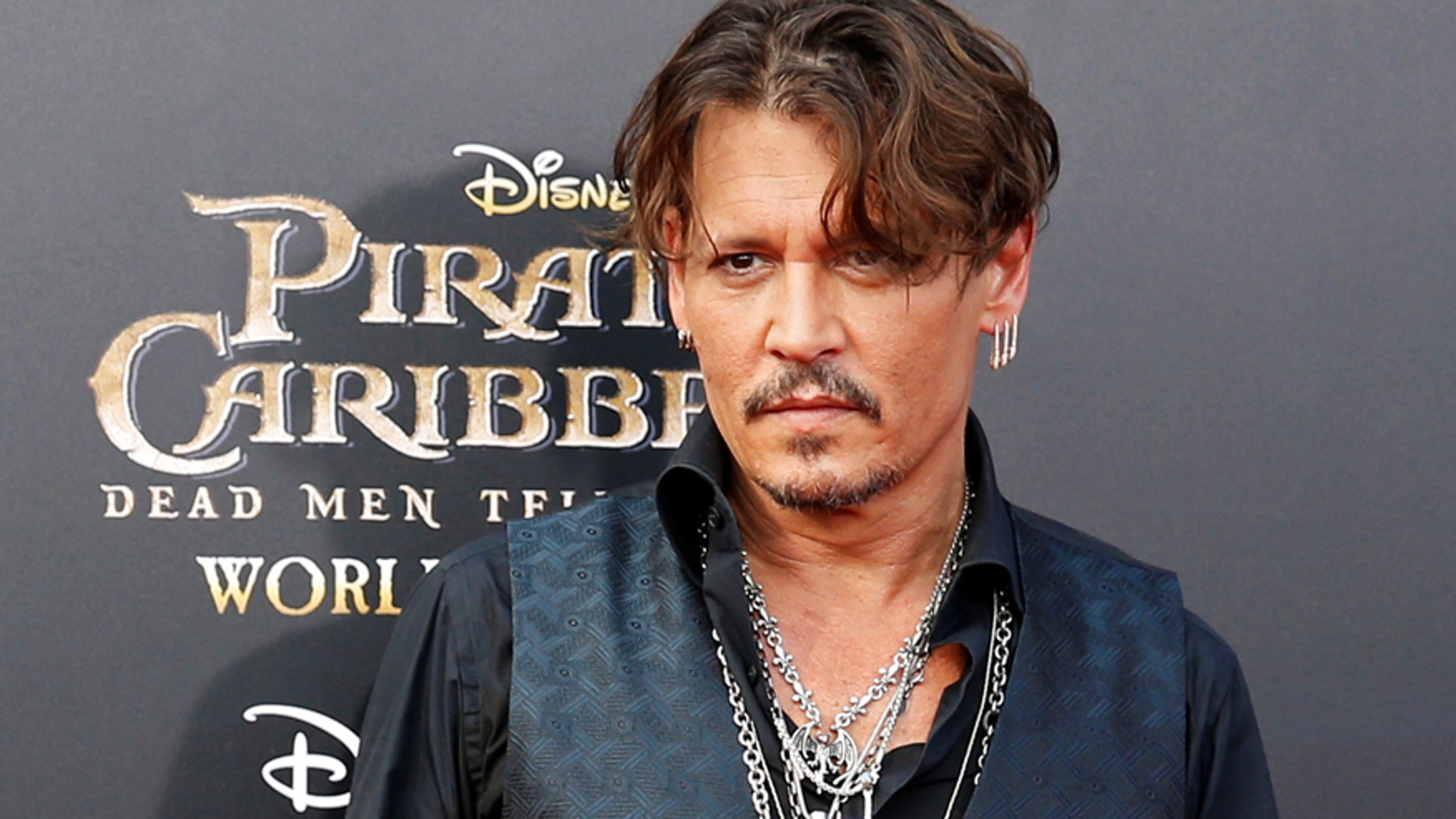 Actor Johnny Depp arrives on the red carpet for the global premiere of the film "Pirates of the Caribbean: Dead Men Tell No Tales", in Shanghai, China May 11, 2017.