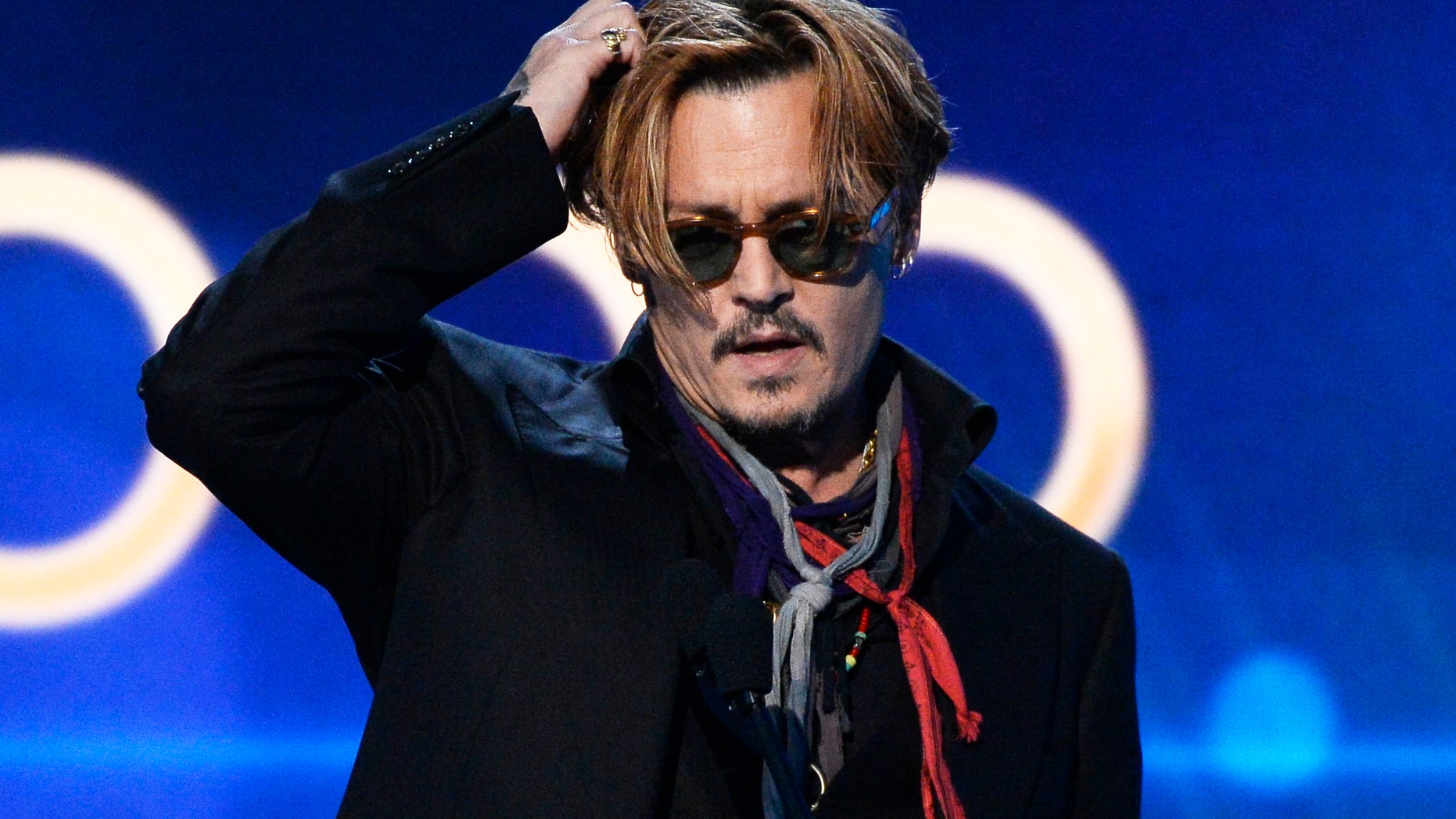 November 14, 2014. Johnny Depp presents the Hollywood Documentary Award to "Supermensch: The Legend of Shep Gordon" during the Hollywood Film Awards in Hollywood, California.