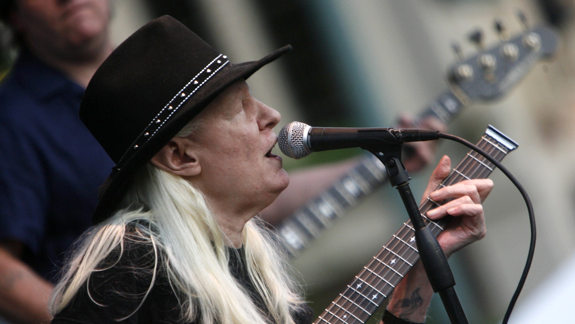 FILE - In this Friday, June 19, 2009 file photo, Johnny Winter plays during the Canton Blues Festival 2009 in downtown Canton, Ohio. Texas blues icon Johnny Winter, who rose to fame in the late 1960s and '70s with his energetic performances and recordings that included producing his childhood hero Muddy Waters, died in Zurich, Switzerland on Wednesday, July 16, 2014. He was 70. (AP Photo/The Repository, Bob Rossiter) MANDATORY CREDIT