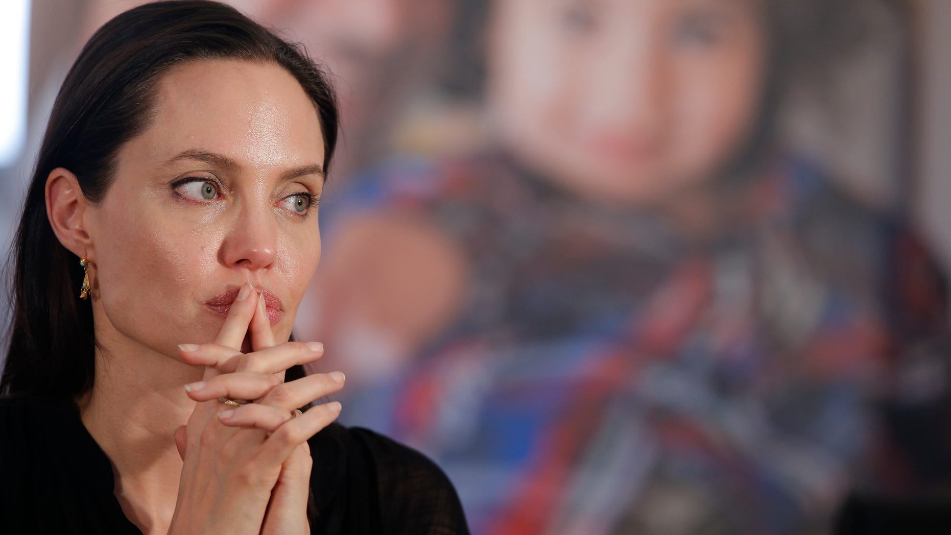 June 20, 2015. Angelina Jolie, Special Envoy of the United Nations High Commissioner for Refugees, listens to a question during a news conference following a visit to the Midyat refugee camp in Mardin, southeastern Turkey, near the Syrian border.