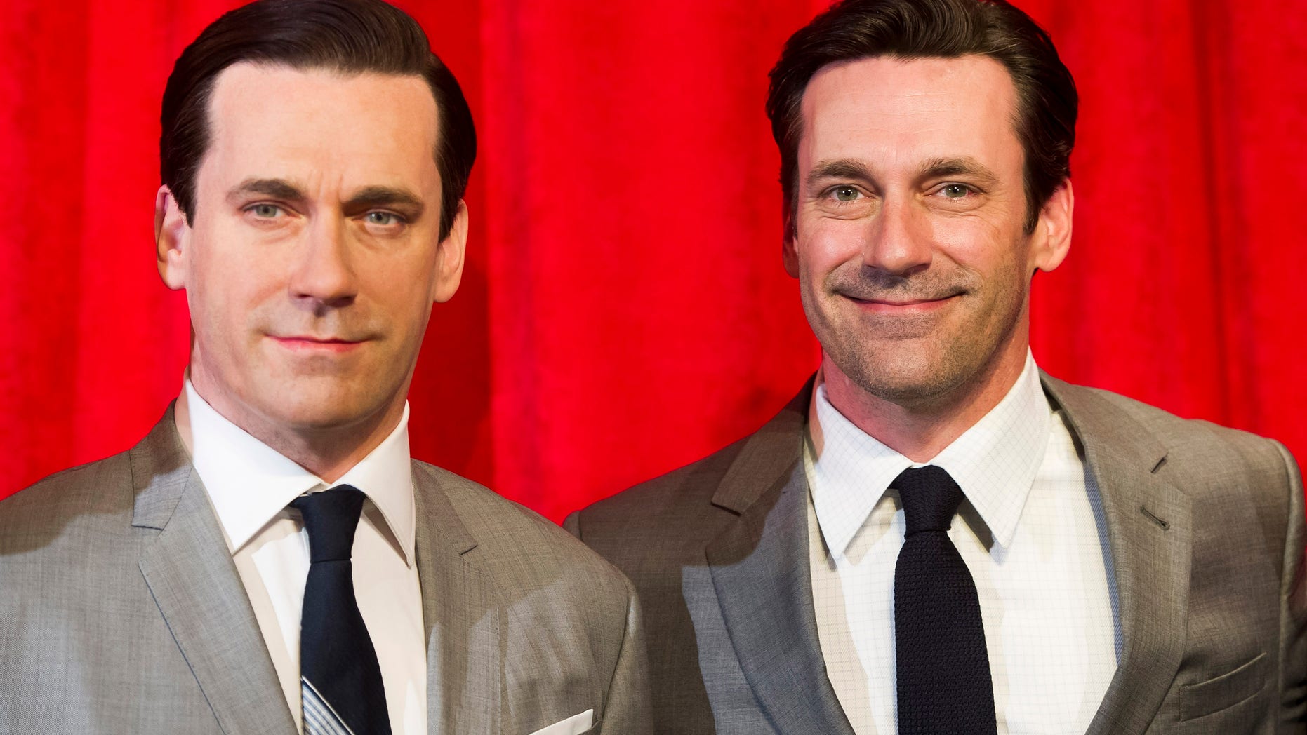 May 9, 2014. Jon Hamm, right, poses with his wax likeness at an unveiling at Madame Tussauds in New York.