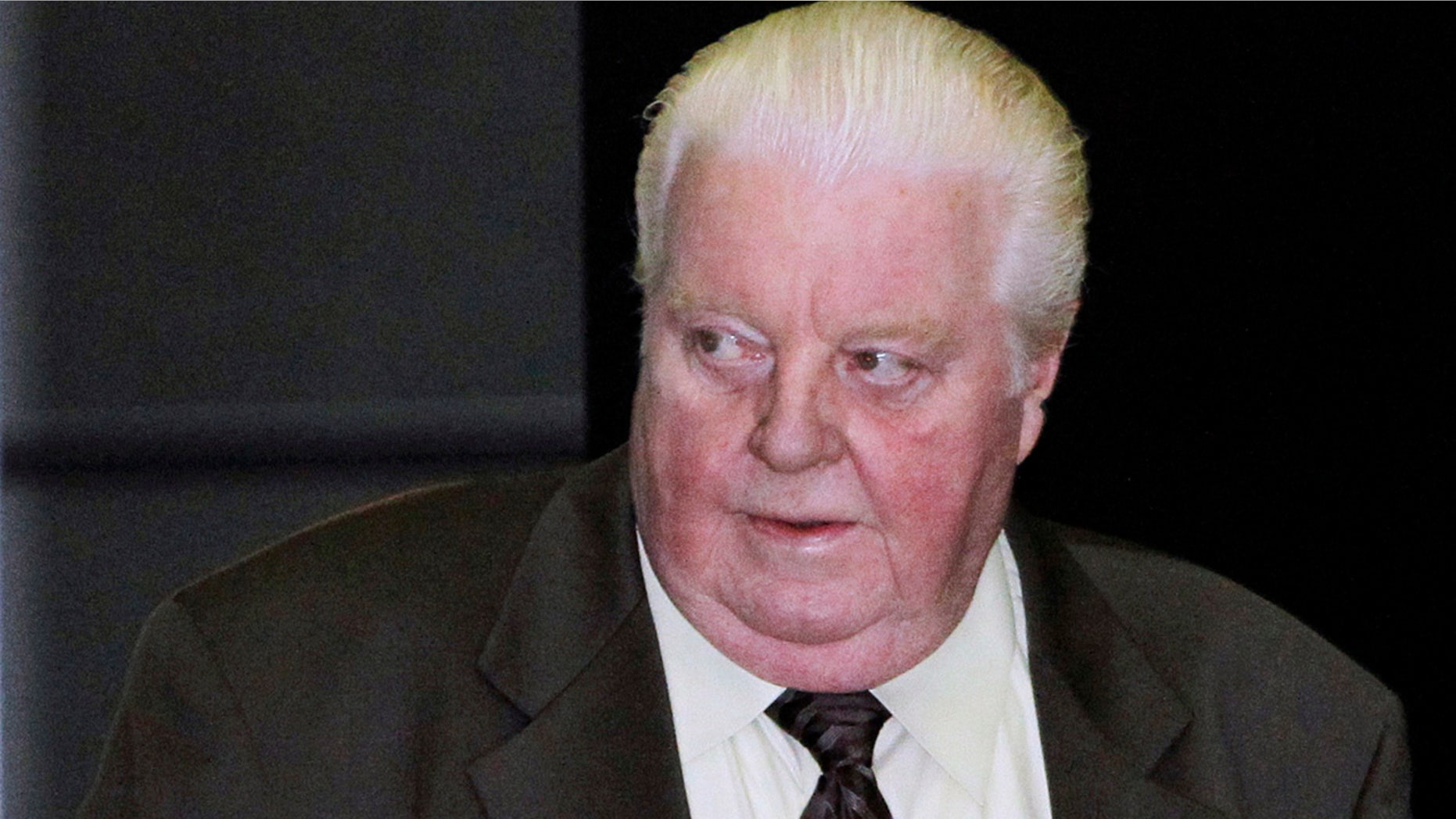 FILE - In this June 8, 2010 file photo, former Chicago Police Lt. Jon Burge arrives at the federal building in Chicago. The city of Chicago has paid $5.5 million in reparations to dozens of people whose claims that they were tortured by a police unit commanded by Burge decades ago were found to be credible. (AP Photo/Charles Rex Arbogast, File)