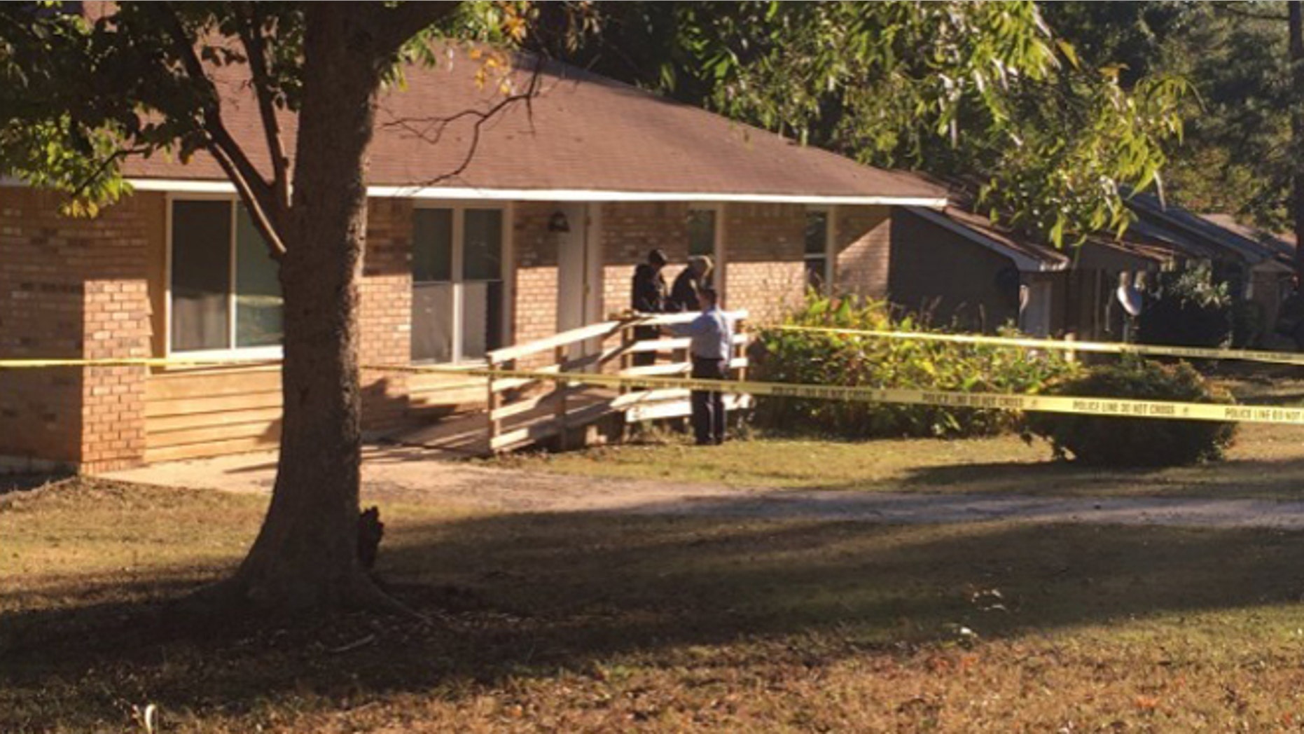 Police outside a home in Jonesboro, Georgia, where two children were shot and killed by an intruder. (Fox 5 Atlanta)