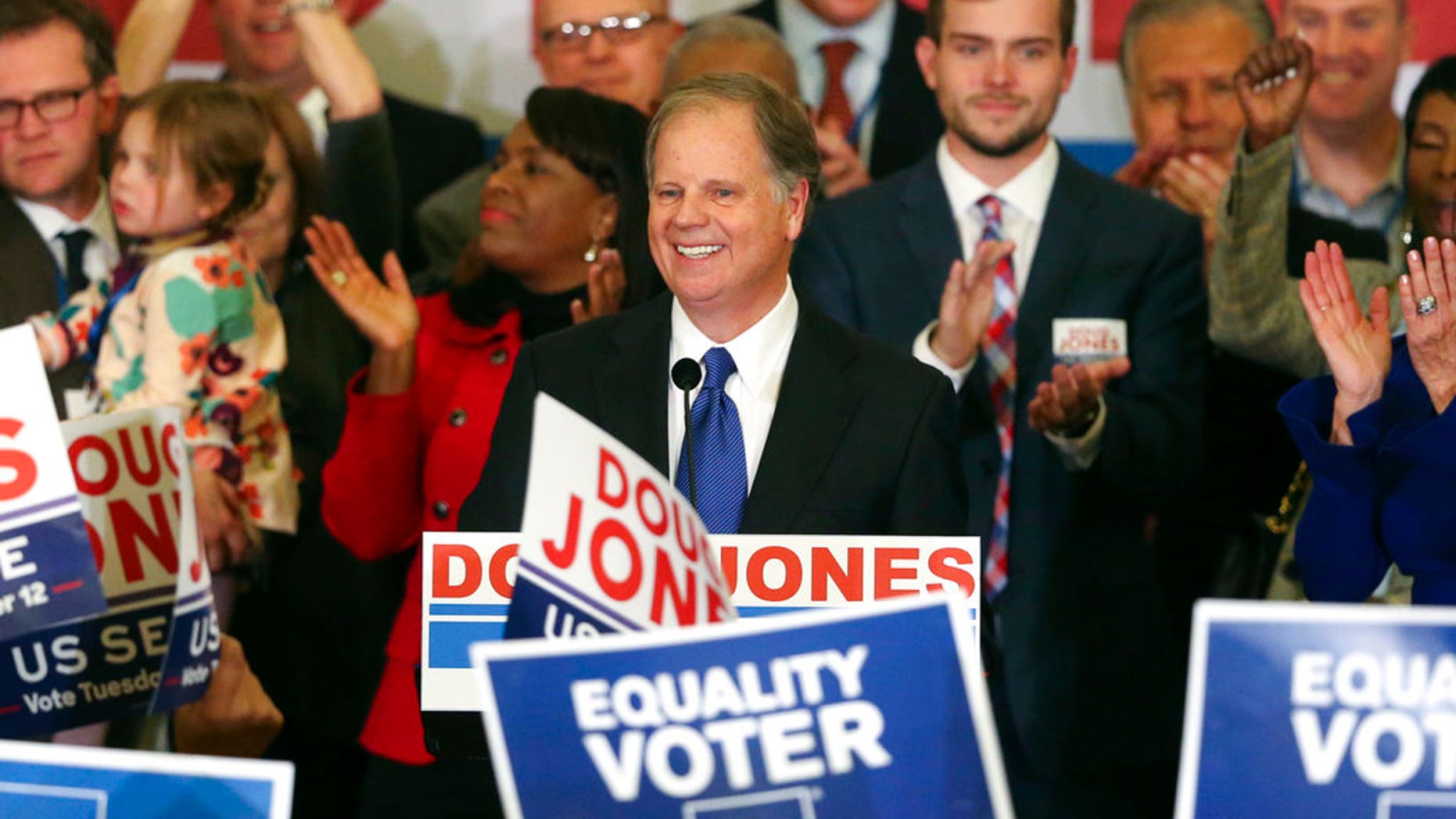 Democrat Doug Jones speaks Tuesday, Dec. 12, 2017, in Birmingham, Ala. In a stunning victory aided by scandal, Jones won Alabama's special Senate election, beating back history, an embattled Republican opponent and President Donald Trump, who urgently endorsed GOP rebel Roy Moore despite a litany of sexual misconduct allegations. (AP Photo/John Bazemore)