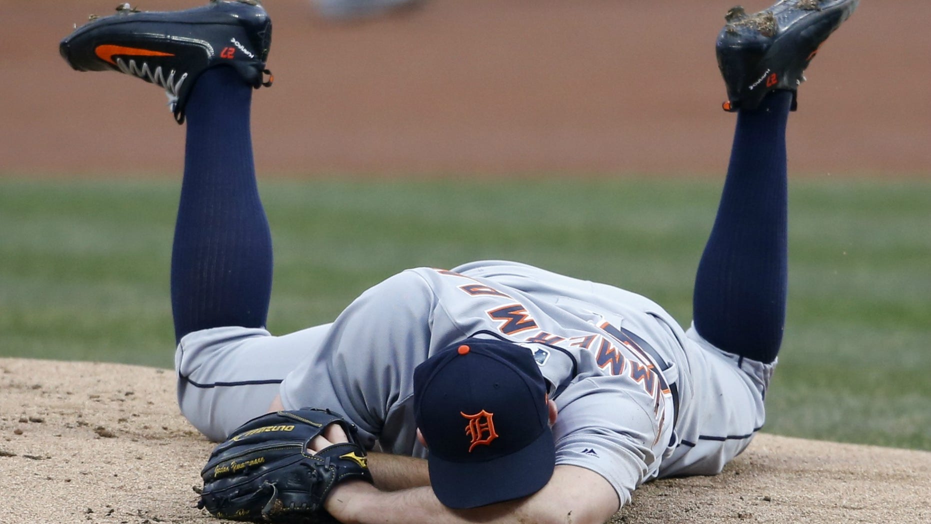 Detroit Tigers pitcher Jordan Zimmermann awaits medical attention after he was struck in the jaw by a line drive in a game against the Cleveland Indians, April 11, 2018.