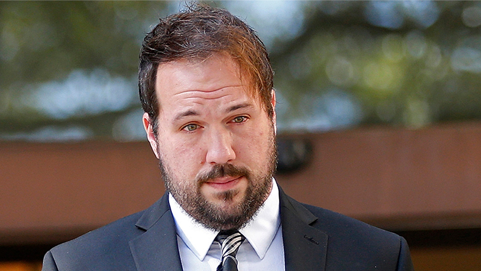 Jordan Hamlett, left, leaves federal court with his attorney Michael Fiser, following his guilty plea in Baton Rouge, La., Monday, Dec. 11, 2017. The Louisiana private investigator pleaded guilty in his alleged attempts to access Donald Trump's tax returns during the presidential campaign. Authorities have said Hamlett failed in his attempts to get Trump's tax returns through a U.S. Department of Education financial aid website. The 32-year-old Lafayette resident was charged with misusing a Social Security number. His trial had been scheduled to start this week, but the judge originally assigned to the case died Saturday. (AP Photo/Gerald Herbert)