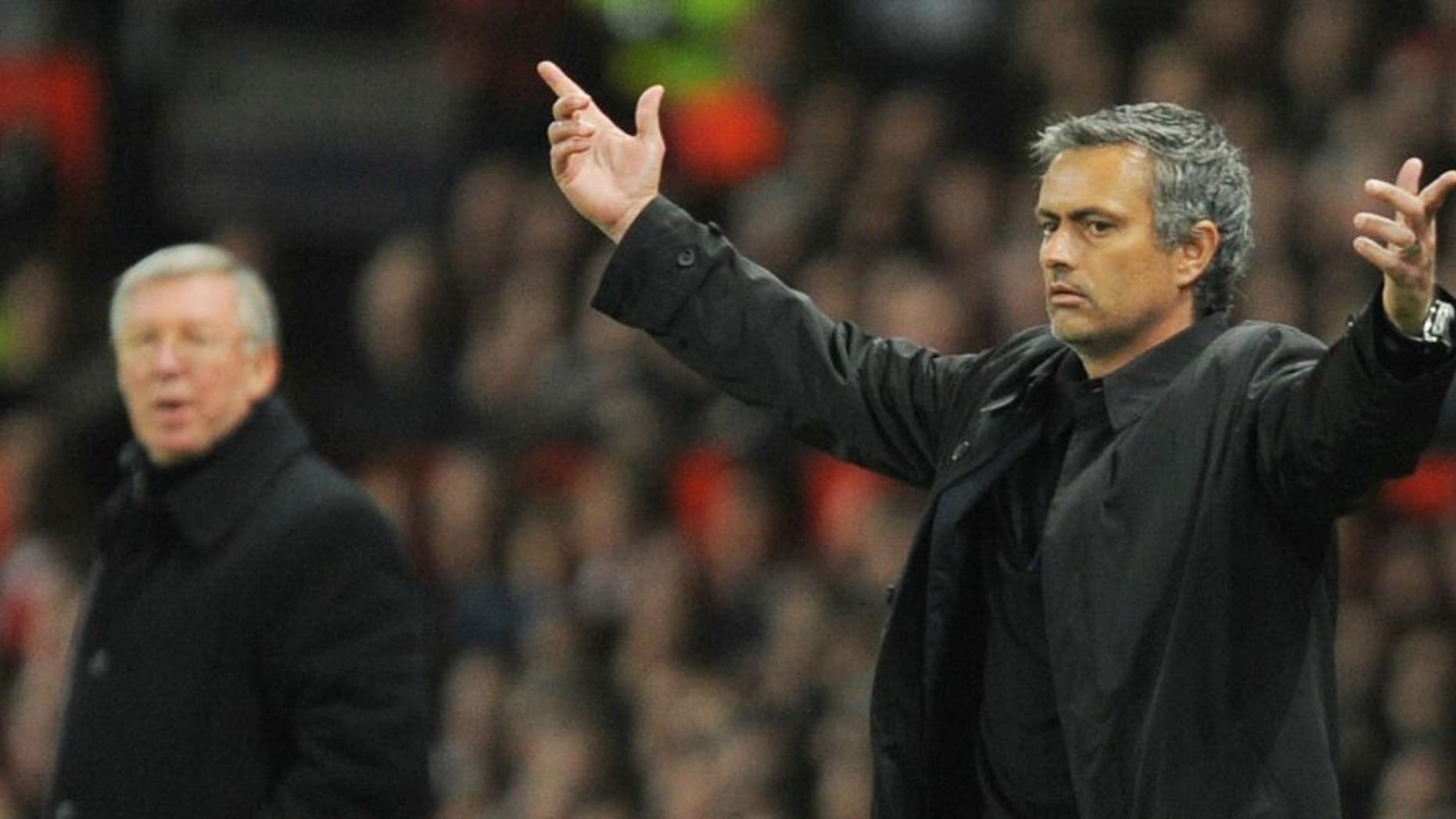 Inter Milan's Portuguese coach Jose Mourinho (R) gestures next to Manchester United manager Sir Alex Ferguson during their UEFA Champions League second round second leg football match at Old Trafford in Manchester, north west England on March 11, 2009. AFP PHOTO/ANDREW YATES (Photo credit should read ANDREW YATES/AFP/Getty Images)