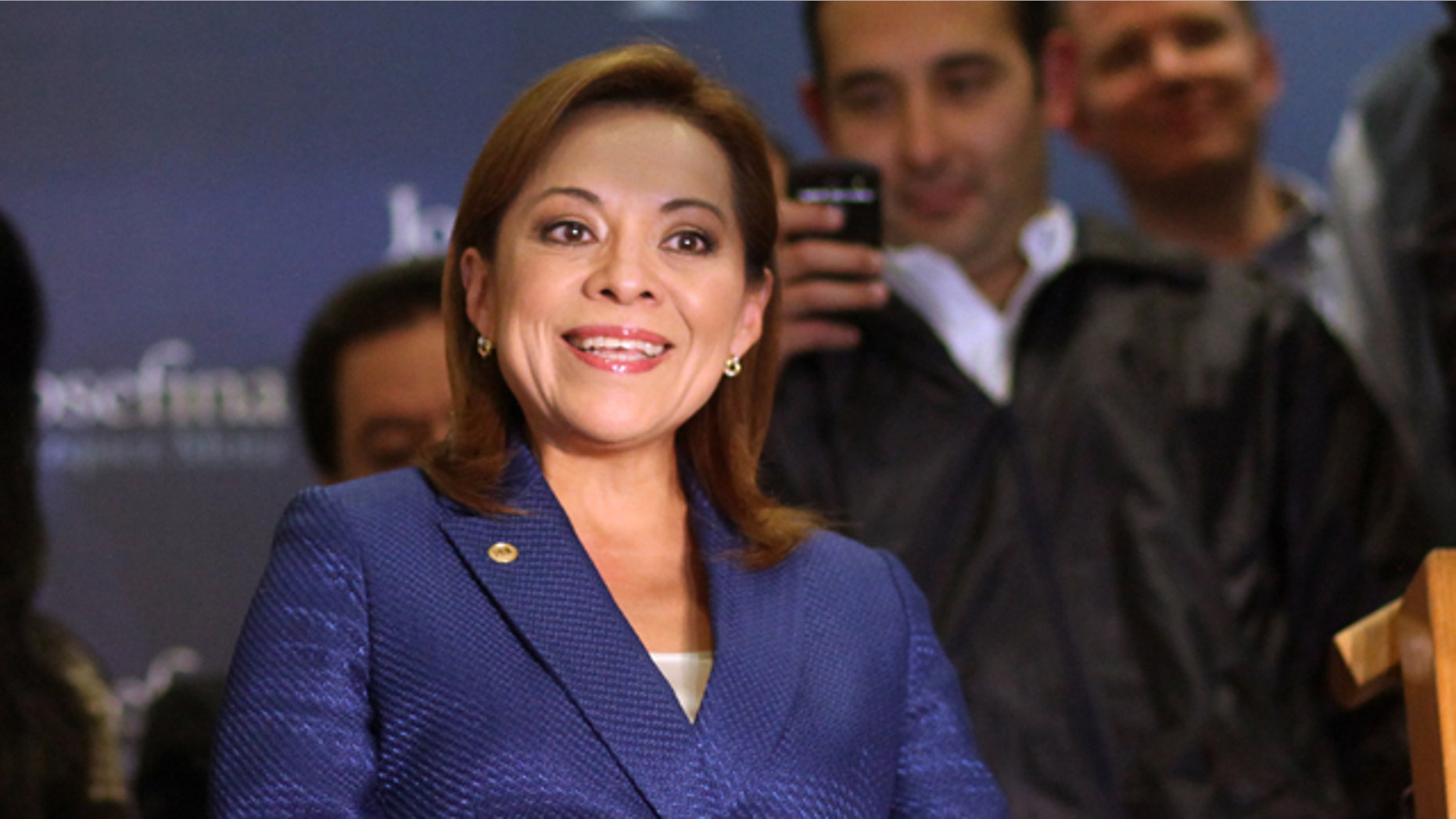 Feb. 5, 2012: Former congresswoman Josefina Vazquez Mota, front, speaks to journalists and supporters prior to know about her party's primary elections final results in Mexico City.