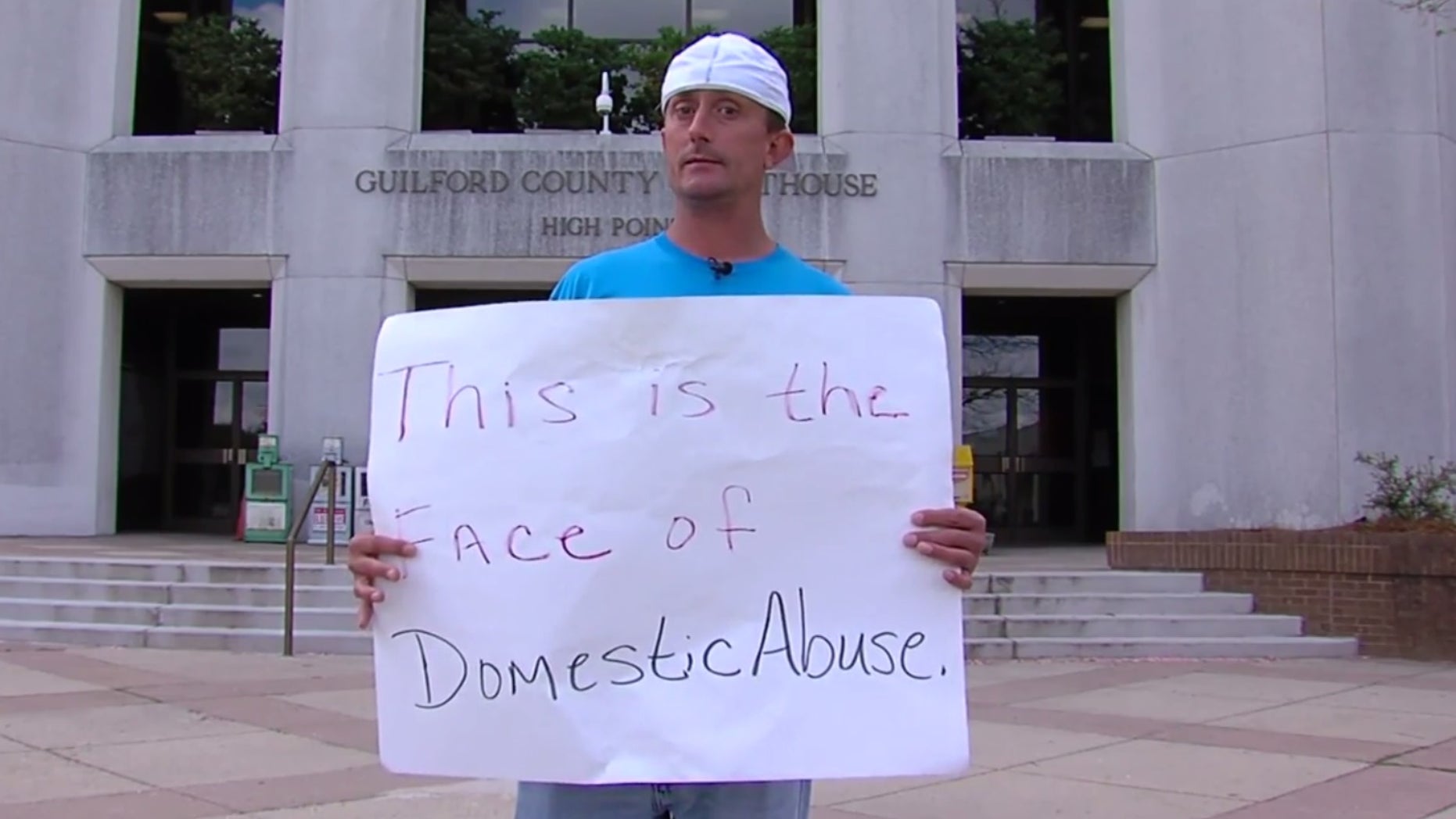 Josh Hill standing outside the courthouse.