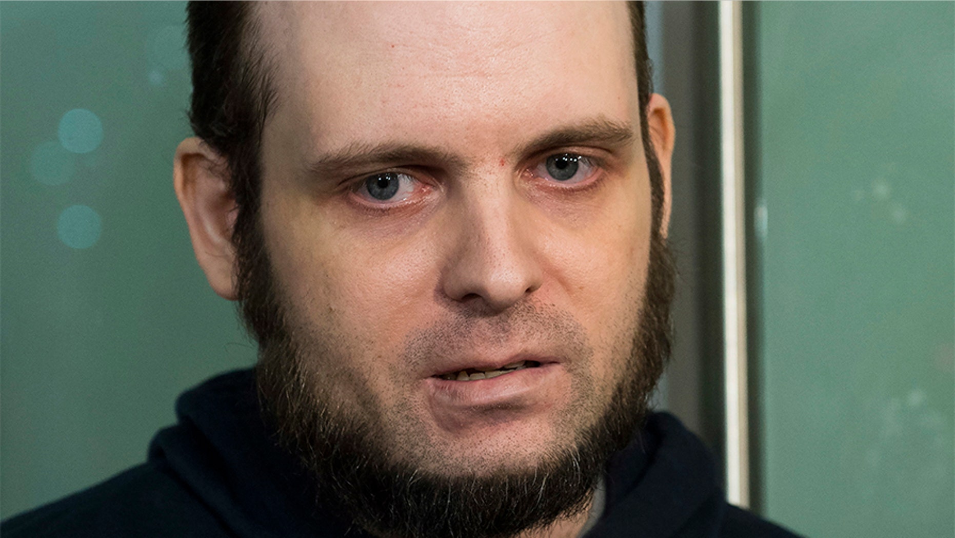 Joshua Boyle speaks to the media after arriving at the Pearson International Airport in Toronto in October. The former Afghanistan hostage will undergo a comprehensive psychiatric assessment after a court appearance in Ottawa Friday.