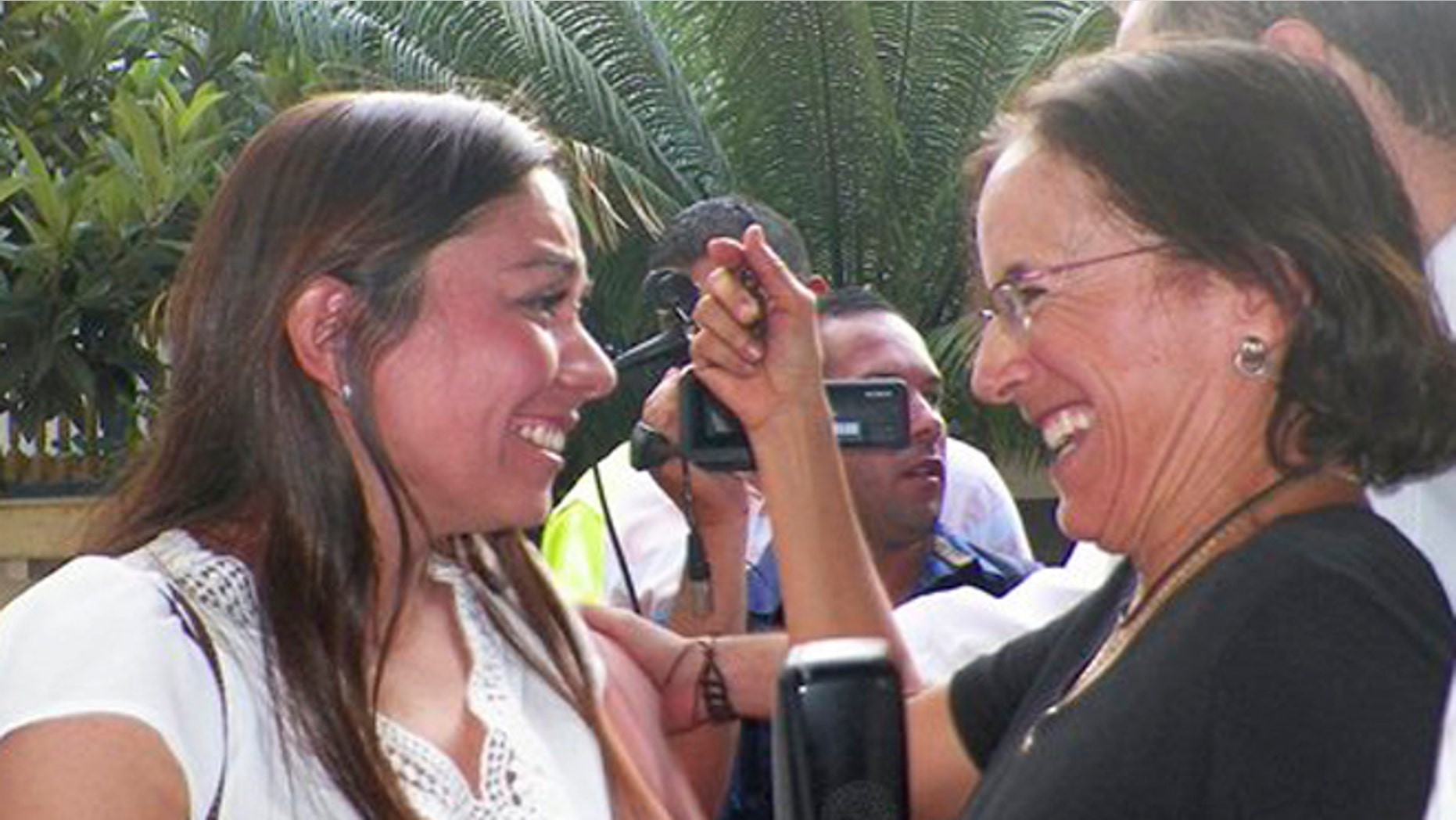 Salud Hernandez-Mora, right, correspondent in Colombia for Spain's El Mundo and columnist for the Bogota daily El Tiempo, is greeted by Melisa Gomez after Salud was freed by rebels of the National Liberation Army (ELN) in Ocana, northeastern Colombia, Friday, May 27, 2016. Gomez is the wife of Jose Cabrales Camacho, a man who was held captive by the ELN for seven months. Hernandez-Mora said she was taken captive on May 21 while working on a story about coca growers in a mountainous area dominated by rebels and drug-traffickers near the border with Venezuela. (AP Photo)