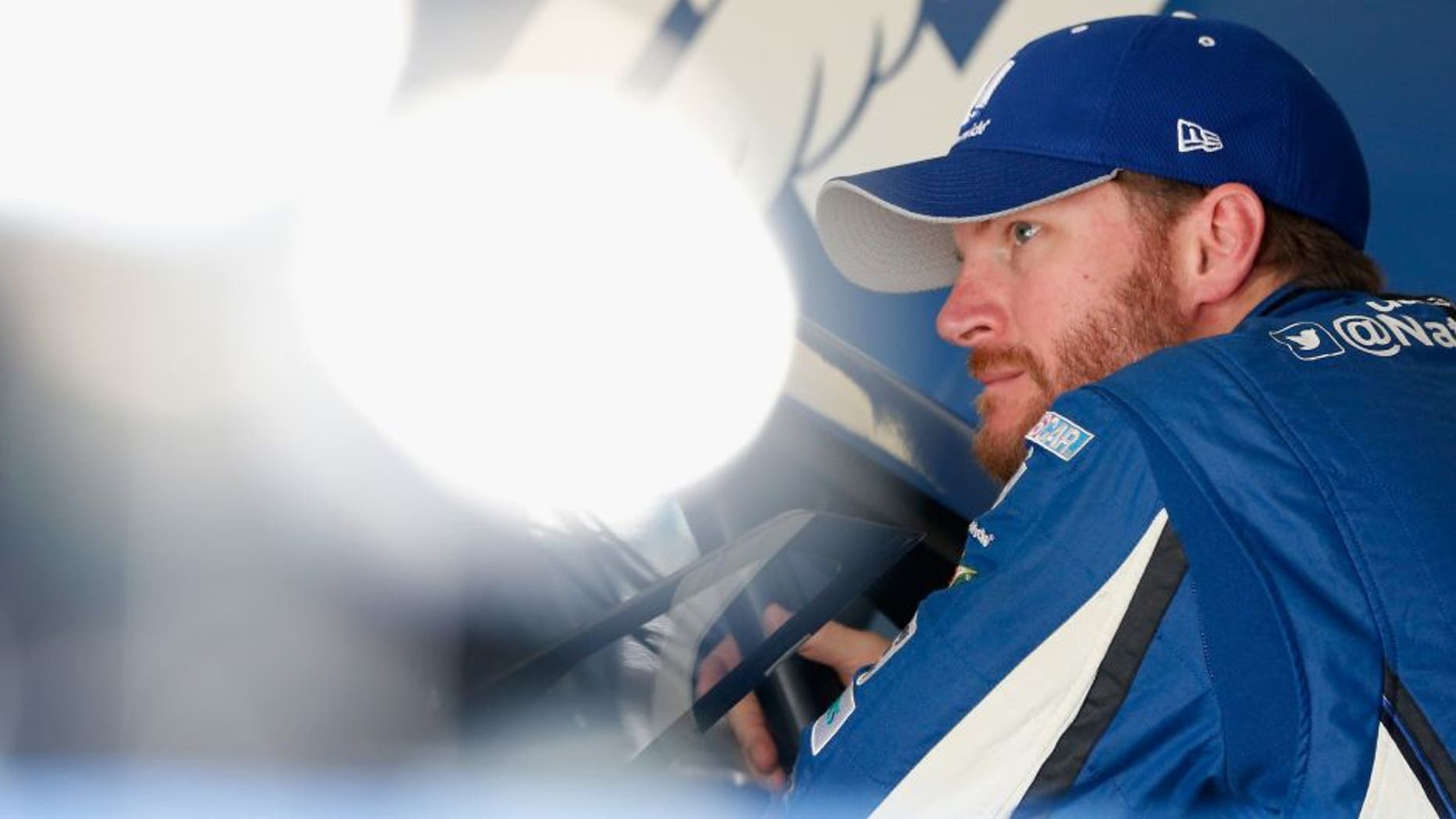 HOMESTEAD, FL - NOVEMBER 20: Dale Earnhardt Jr., driver of the #88 Nationwide Chevrolet, stands in the garage area during practice for the NASCAR Sprint Cup Series Ford EcoBoost 400 at Homestead-Miami Speedway on November 20, 2015 in Homestead, Florida. (Photo by Brian Lawdermilk/Getty Images)