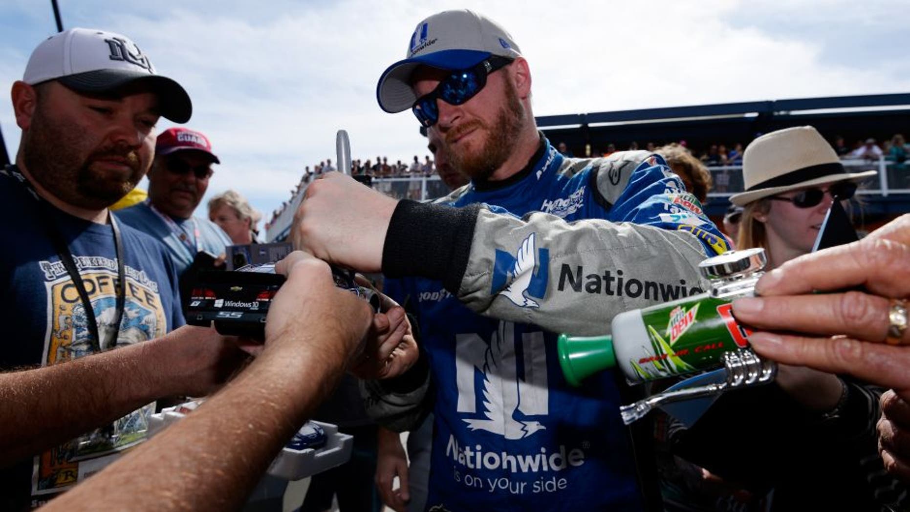 LAS VEGAS, NV - MARCH 04: Dale Earnhardt Jr, driver of the #88 Nationwide Chevrolet, signs autographs for fans during practice for the NASCAR Sprint Cup Series Kobalt 400 at Las Vegas Motor Speedway on March 4, 2016 in Las Vegas, Nevada. (Photo by Robert Laberge/Getty Images)