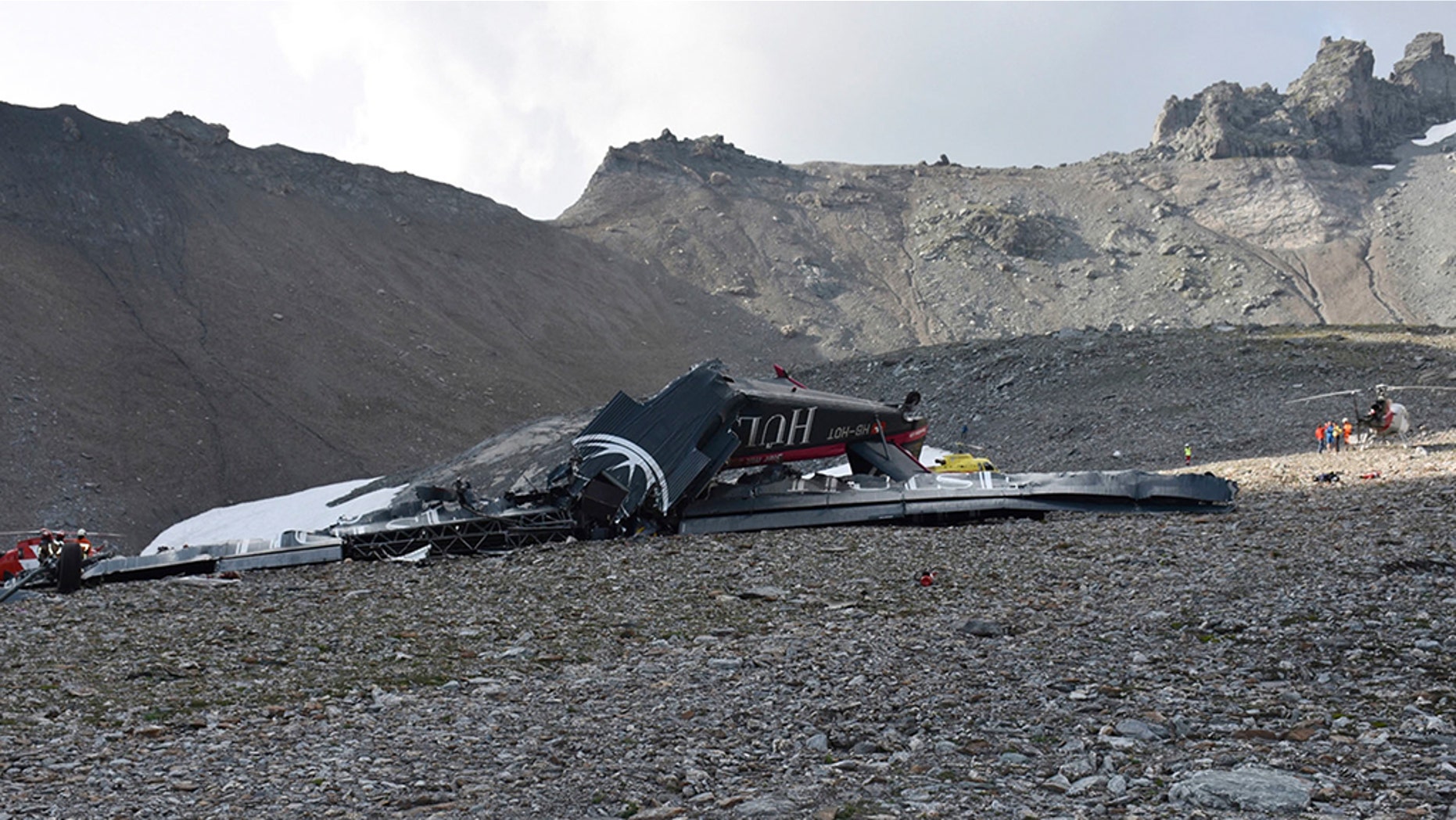The photo provided by Police Graubuenden shows the wreckage of the old-time propeller plane Ju 52 after it went down went down Saturday Aug, 4 2018 on the Piz Segnas mountain above the Swiss Alpine resort of Flims, striking the mountain's western flank about 2,540 meters (8,330 feet) above sea level. All 20 people on board were killed, police said Sunday, Aug. 5, 2018. (Polizei Graubuenden via AP)