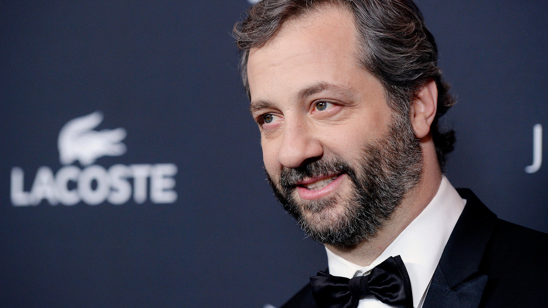 Distinguished Collaborator Service Honoree Judd Apatow arrives for the 16th Costume Designers Guild Awards in Beverly Hills, California February 22, 2014. REUTERS/Kevork Djansezian (UNITED STATES - Tags: ENTERTAINMENT HEADSHOT) - RTX19CEW