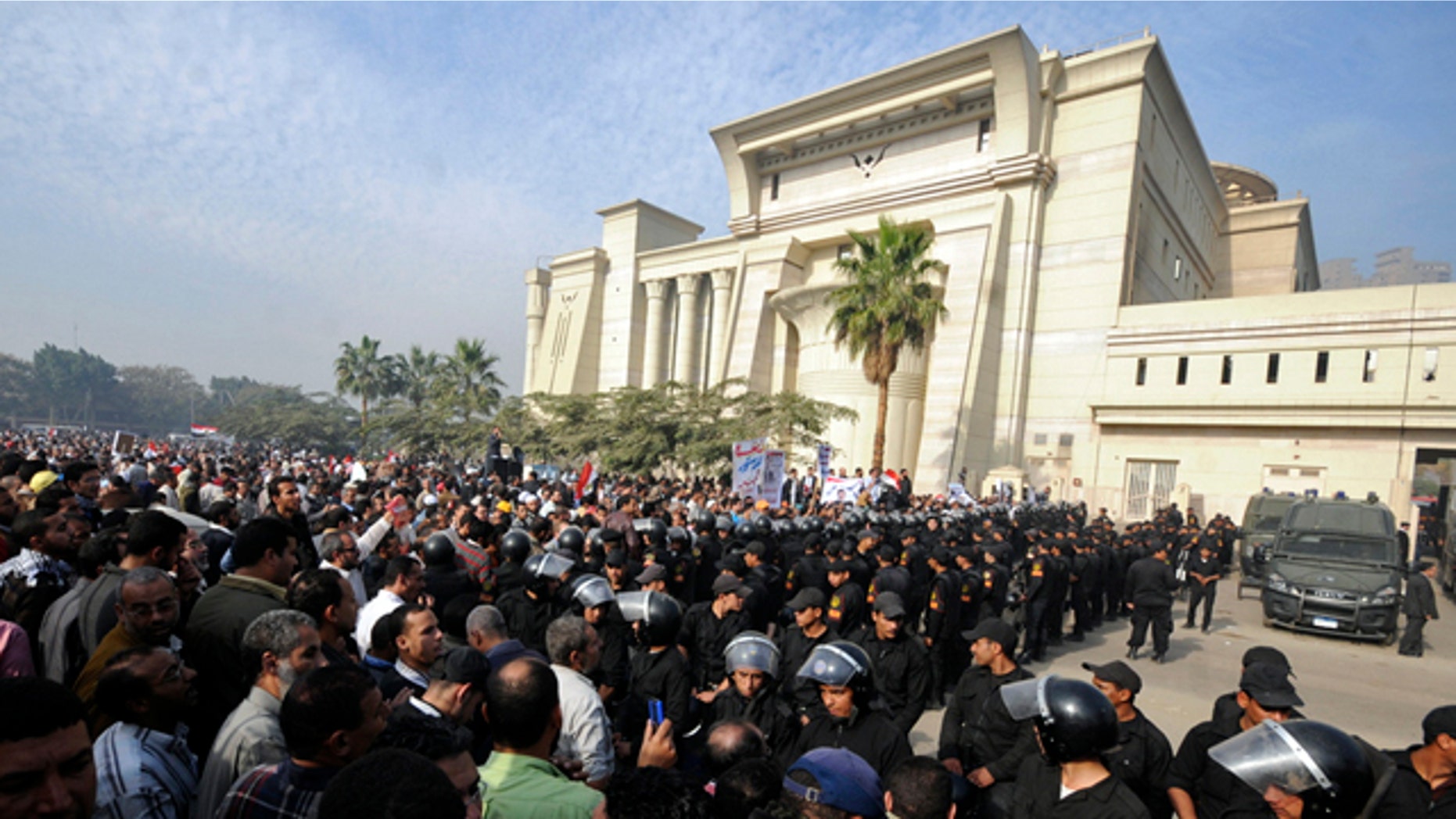 Dec. 2, 2012: Riot police form a cordon as several thousand supporters of Islamist President Mohammed Morsi surround the Supreme Constitutional Court on Sunday.