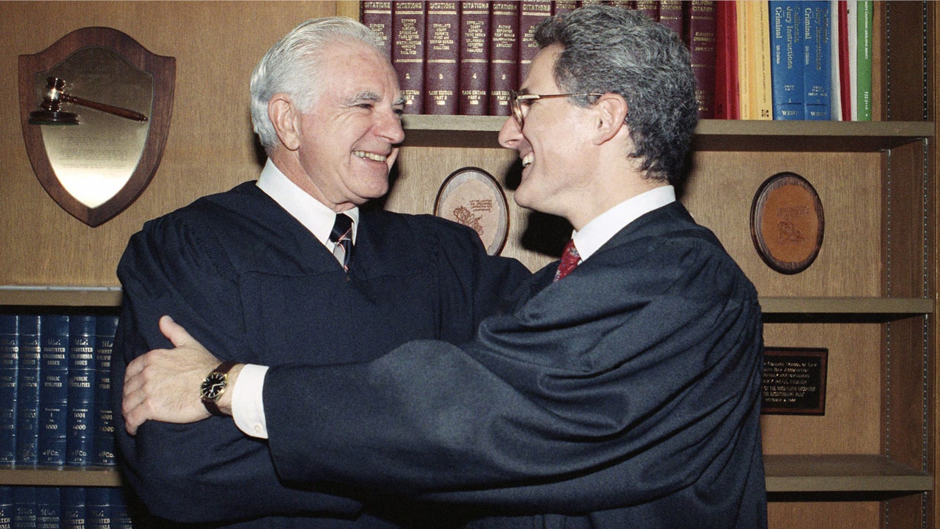 Oct. 13, 1989: Retired Judge Joseph A. Wapner of TV's 'The People's Court' congratulates his son, Judge Frederick N. Wapner, right, as he was enrobed as a Municipal Court judge in Los Angeles.