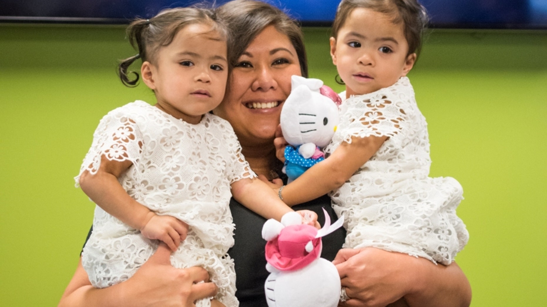 Zoey and Zayne Espayos are pictured with Judiel Ennis.