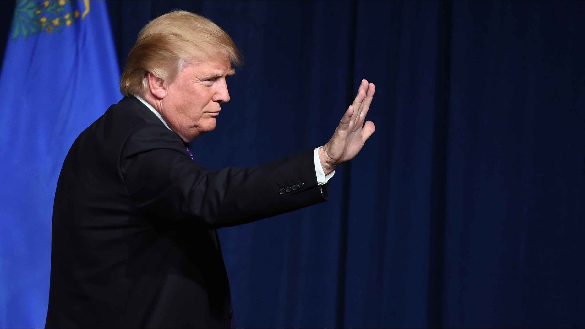 LAS VEGAS, NV - FEBRUARY 23: Republican presidential candidate Donald Trump waves after speaking at a caucus night watch party at the Treasure Island Hotel & Casino on February 23, 2016 in Las Vegas, Nevada. The New York businessman won his third state victory in a row in the "first in the West" caucuses. (Photo by Ethan Miller/Getty Images)