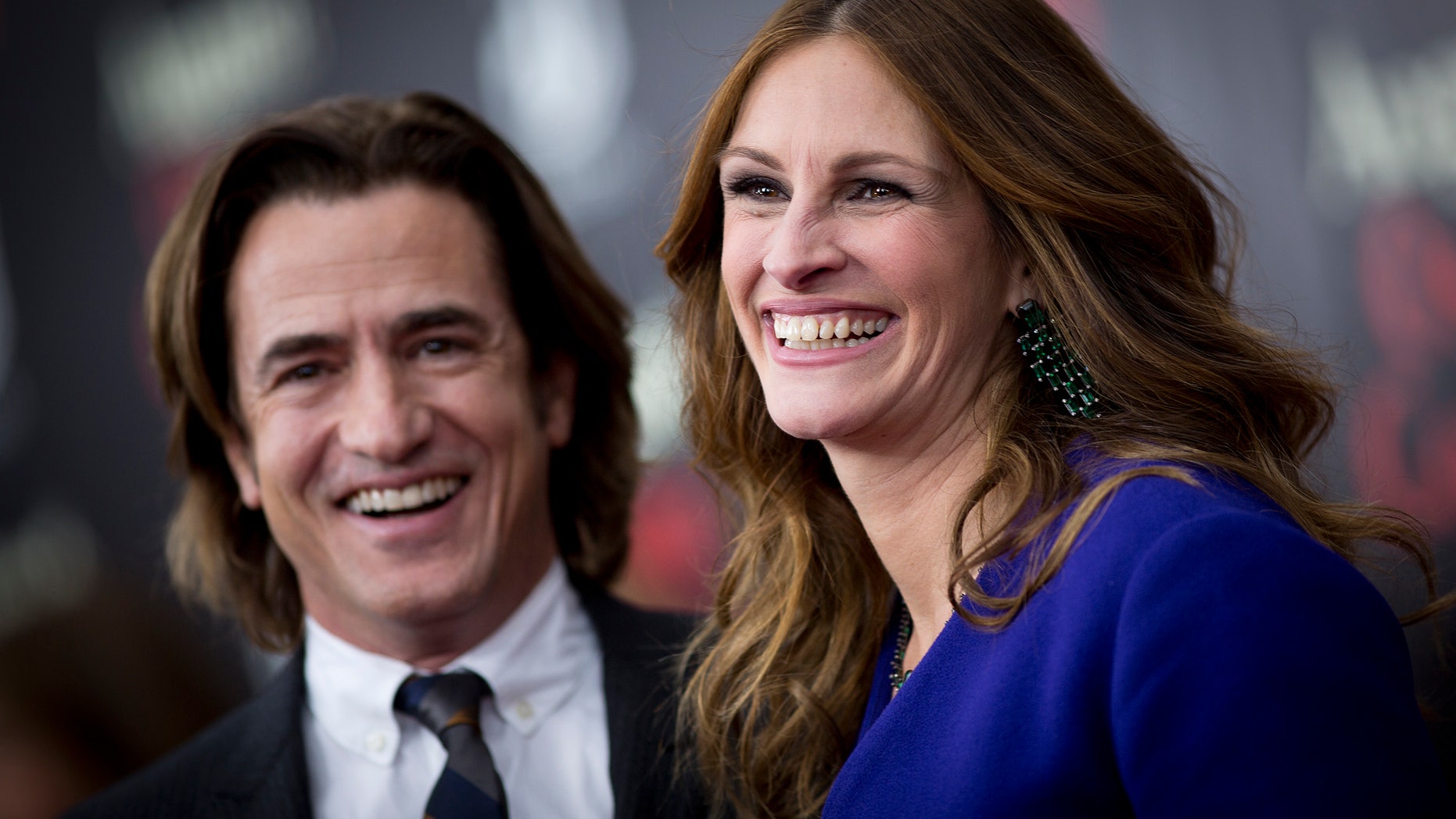 December 12, 2013. Cast members Dermot Mulroney and Julia Roberts arrive for the premiere of the movie "August: Osage County" in New York.