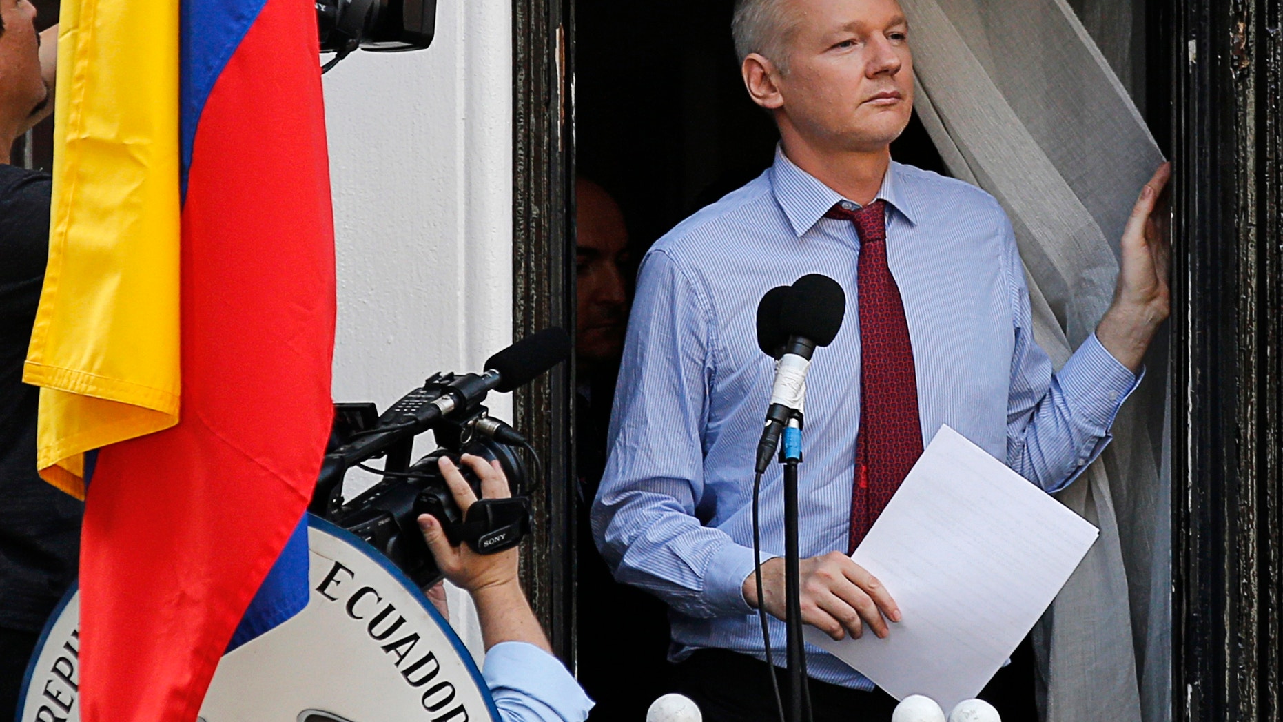 Wikileaks founder Julian Assange arrives to speak from the balcony of Ecuador's embassy, where he is taking refuge in London August 19, 2012.
