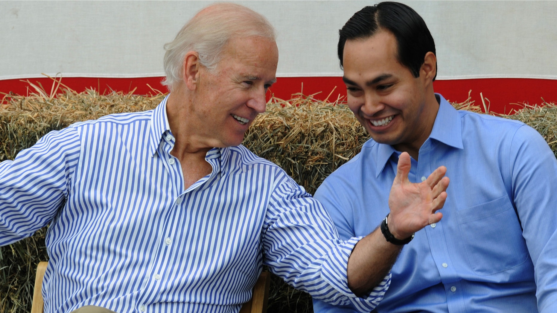 U.S. Vice President Joe Biden and San Antonio Mayor Julian Castro share a moment onstage at the 36th Annual Harkin Steak Fry on September 15, 2013 in Indianola, Iowa.