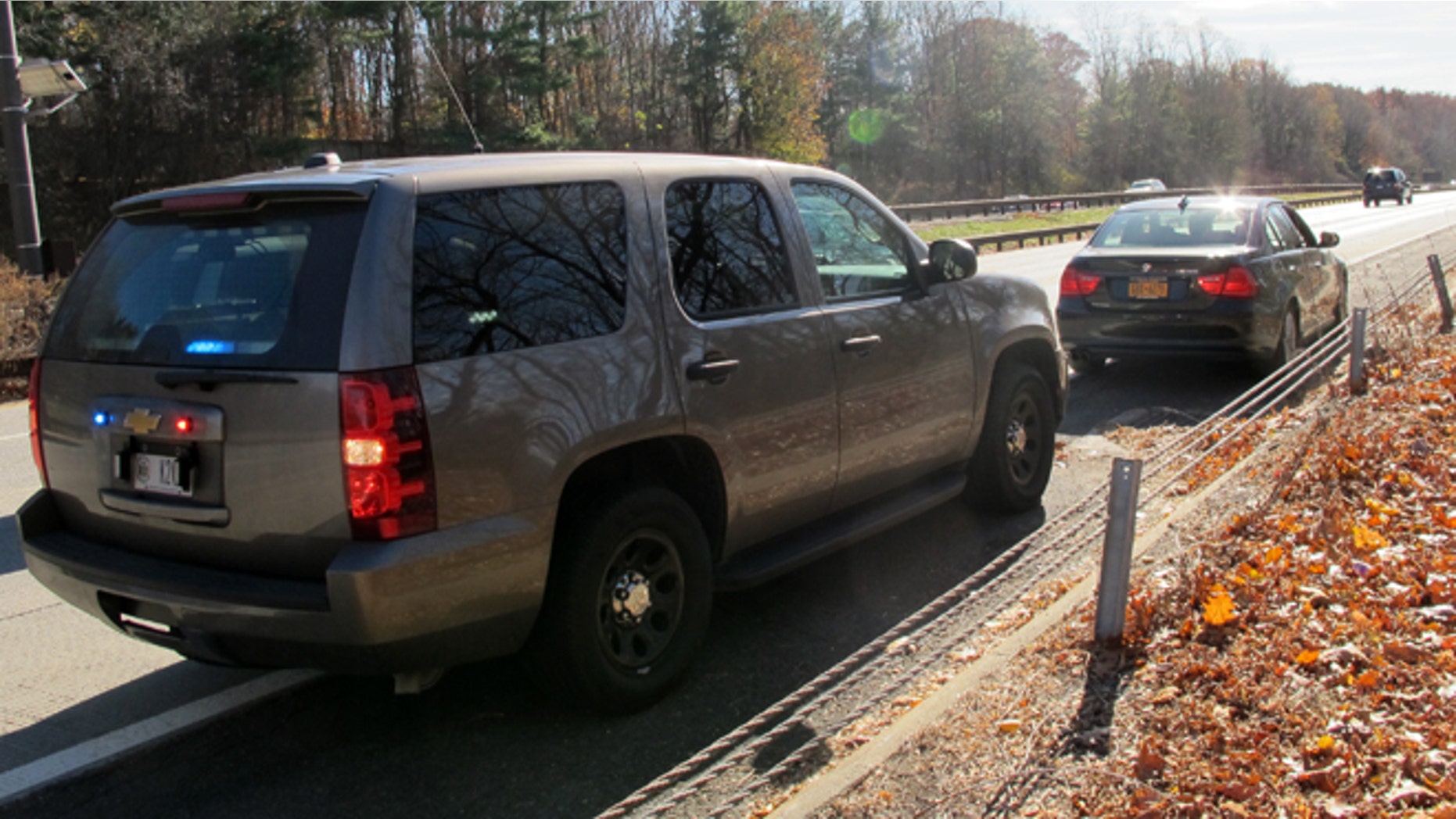 An unmarked New York State Police SUV is seen in Mount Pleasant, N.Y., on Thursday, Nov. 14, 2013, after a trooper pulled over another driver for distracted driving. Troopers are using a fleet of the tall SUVs as part of a crackdown on texting while driving. (AP Photo/Jim Fitzgerald)