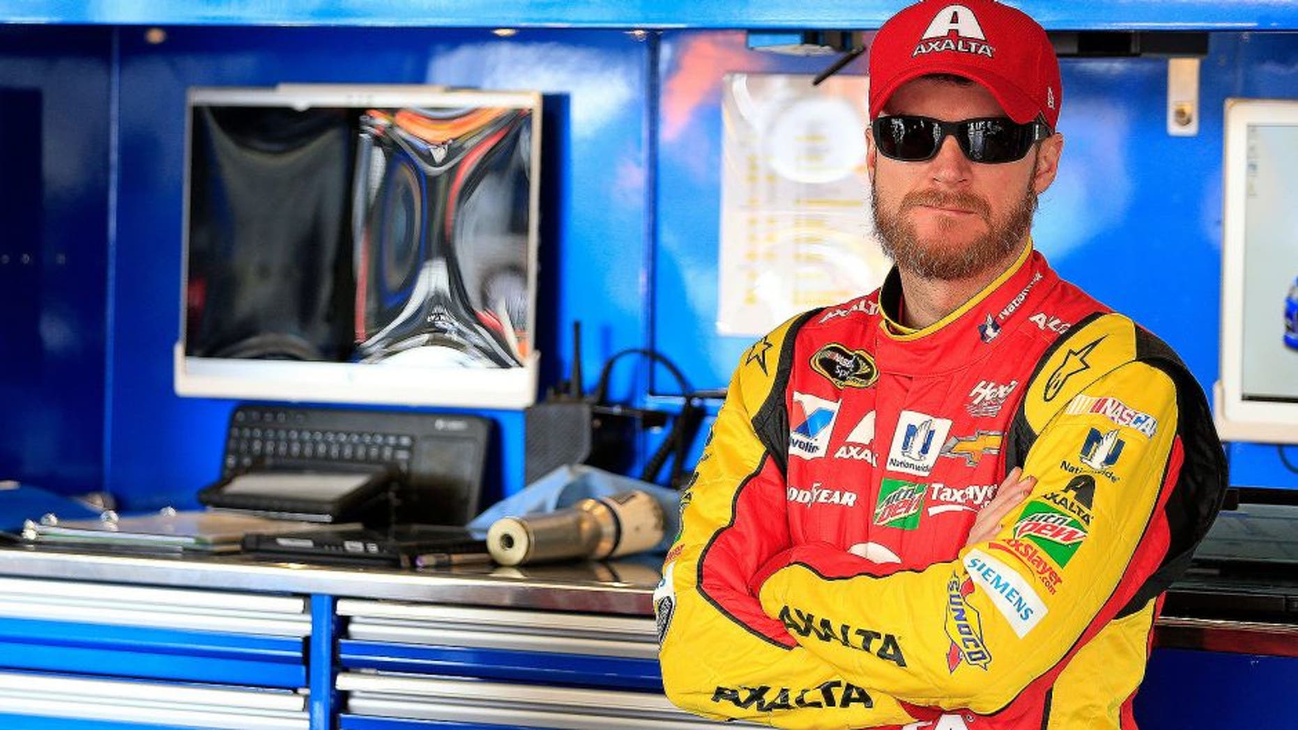 AVONDALE, AZ - MARCH 11: Dale Earnhardt Jr, driver of the #88 Axalta Chevrolet, stands in the garage area during practice for the NASCAR Sprint Cup Series Good Sam 500 at Phoenix International Raceway on March 11, 2016 in Avondale, Arizona. (Photo by Chris Trotman/Getty Images)