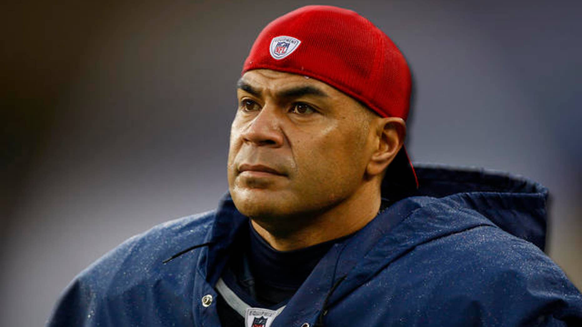 New England Patriots linebacker Junior Seau watches the action from the sidelines during the NFL football game against the Carolina Panthers in Foxborough, Mass., Sunday, Dec. 13, 2009, won by the Patriots 20-10. (AP Photo/Robert E. Klein)